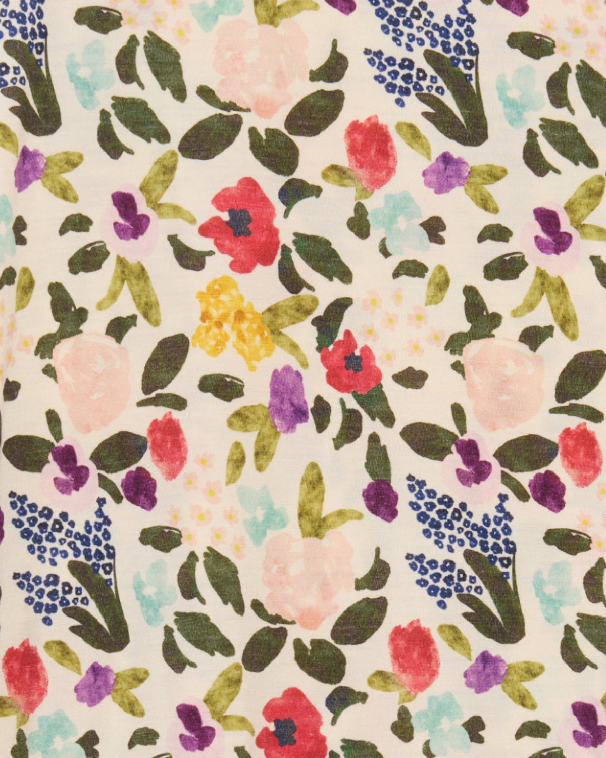 Close-up view of Watercolor Floral Print - a multi-colored floral print on a cream background. 