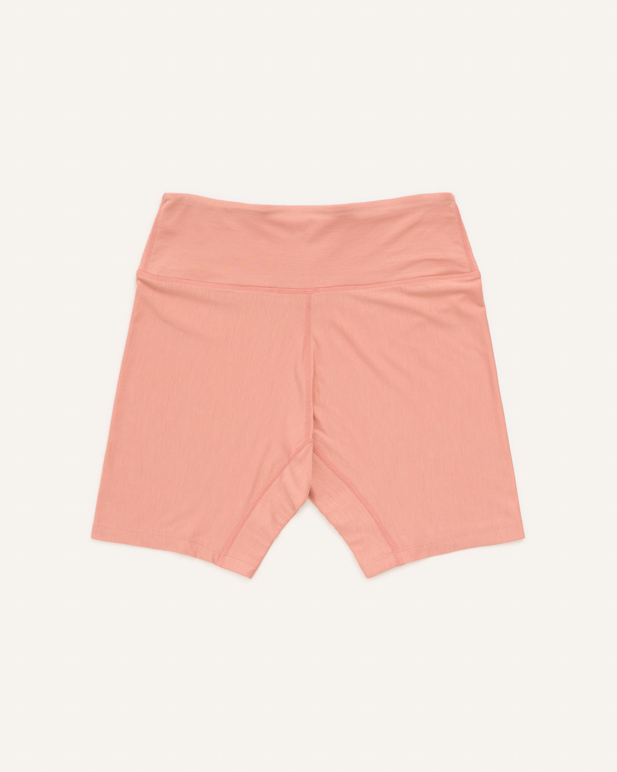 Laydown of Roam Bike Short in Vintage Rose, a soft muted pink color. Roam Bike Short is a merino wool short with pockets available in sizes XS-3X.