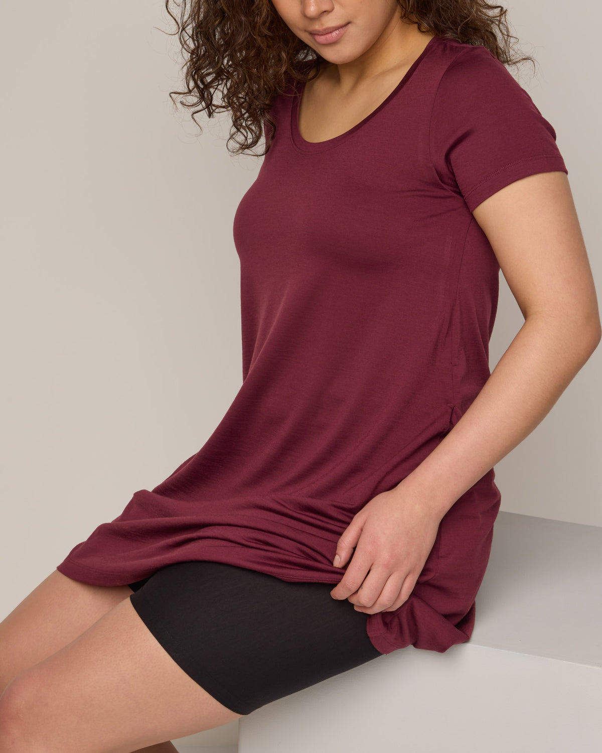 Model wearing Roam Bike Short in Black. Roam Bike Short is a merino wool short with pockets available in sizes XS-3X.