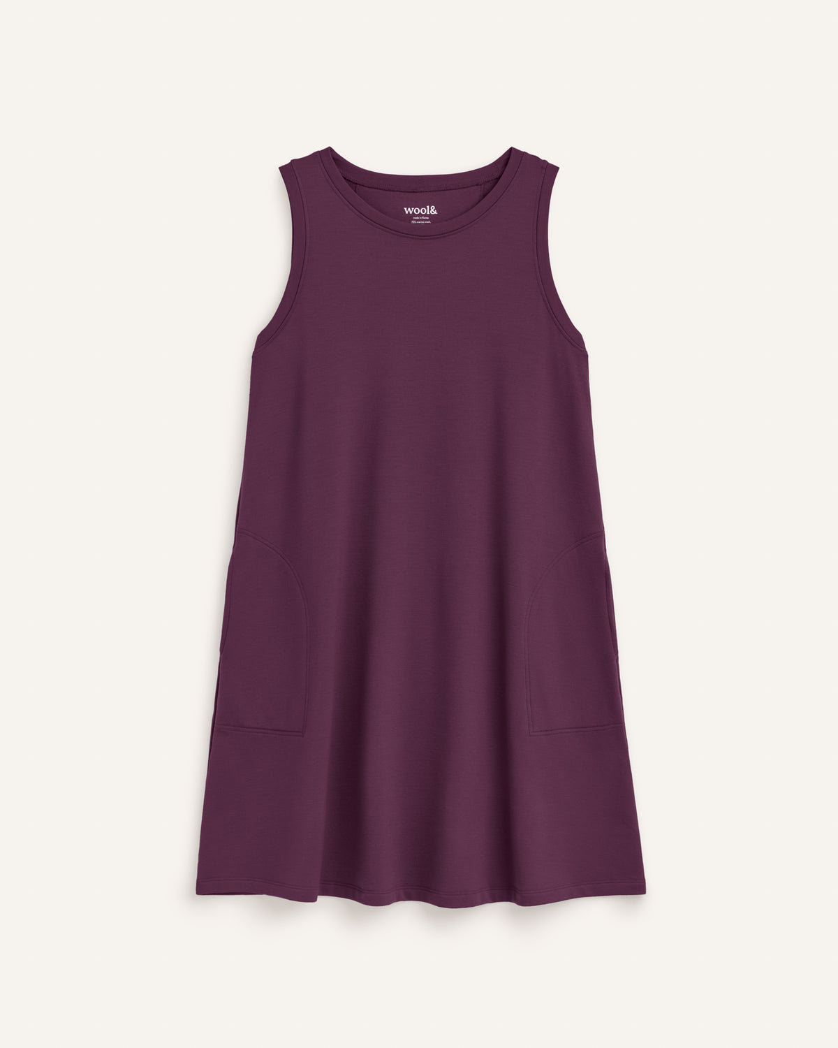 Laydown of Sierra Tank Dress in Marionberry, a dark berry purple color. Sierra Tank Dress is a merino wool sleeveless, crew neck, knee length swing dress with pockets available in sizes XS-3X Regular, XS-3X Long.