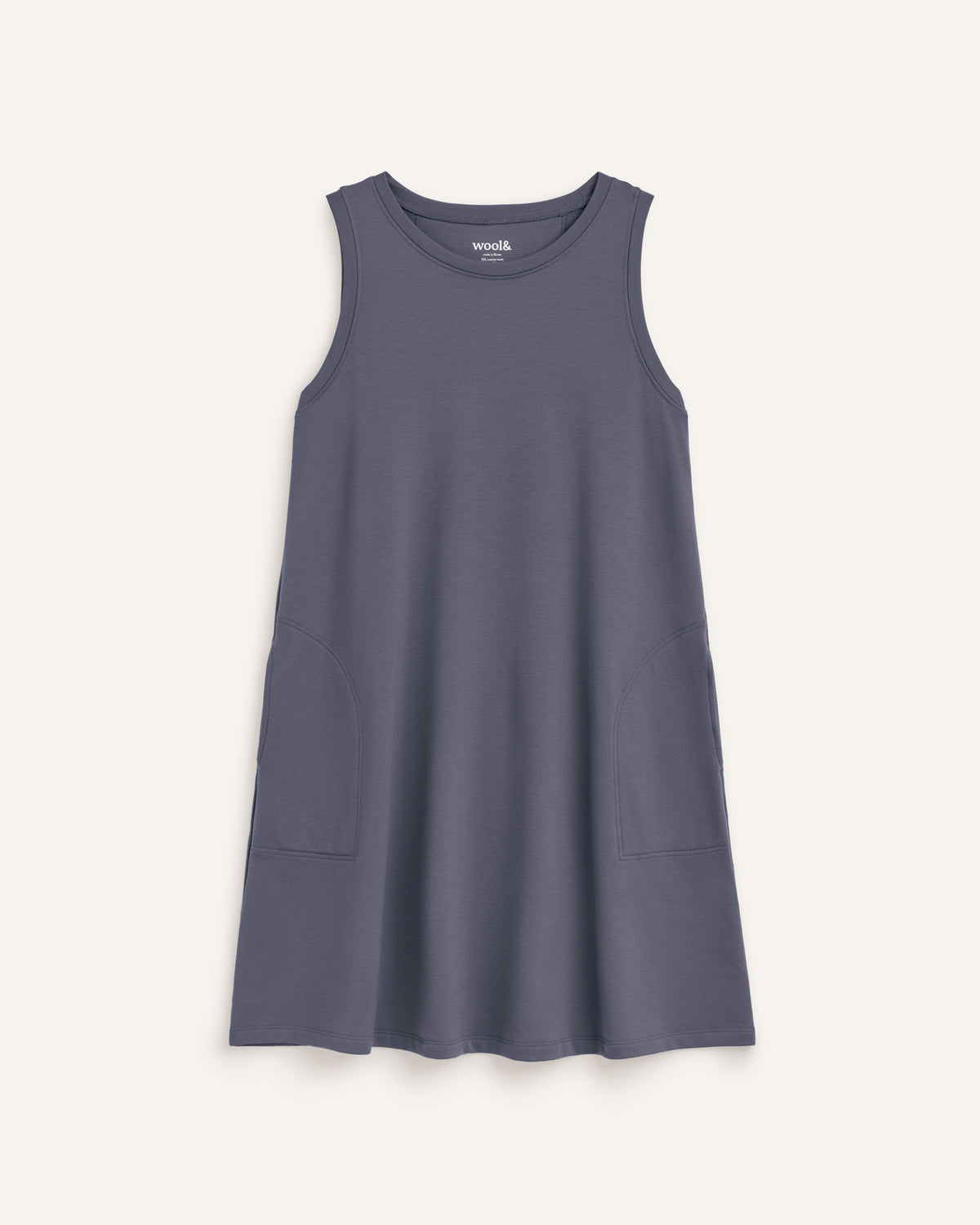 Laydown of Sierra Tank Dress in Odyssey Gray, a neutral purplish-gray color. Sierra Tank Dress is a merino wool sleeveless, crew neck, knee length swing dress with pockets available in sizes XS-3X Regular, XS-3X Long.
