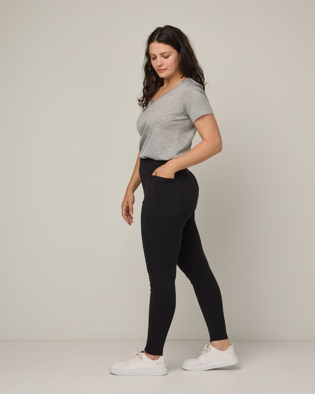 Model wearing Terra Ponte Legging in Black. Terra Ponte Legging is a merino wool legging with pockets available in sizes XS-3X Regular, S-XXL Long.