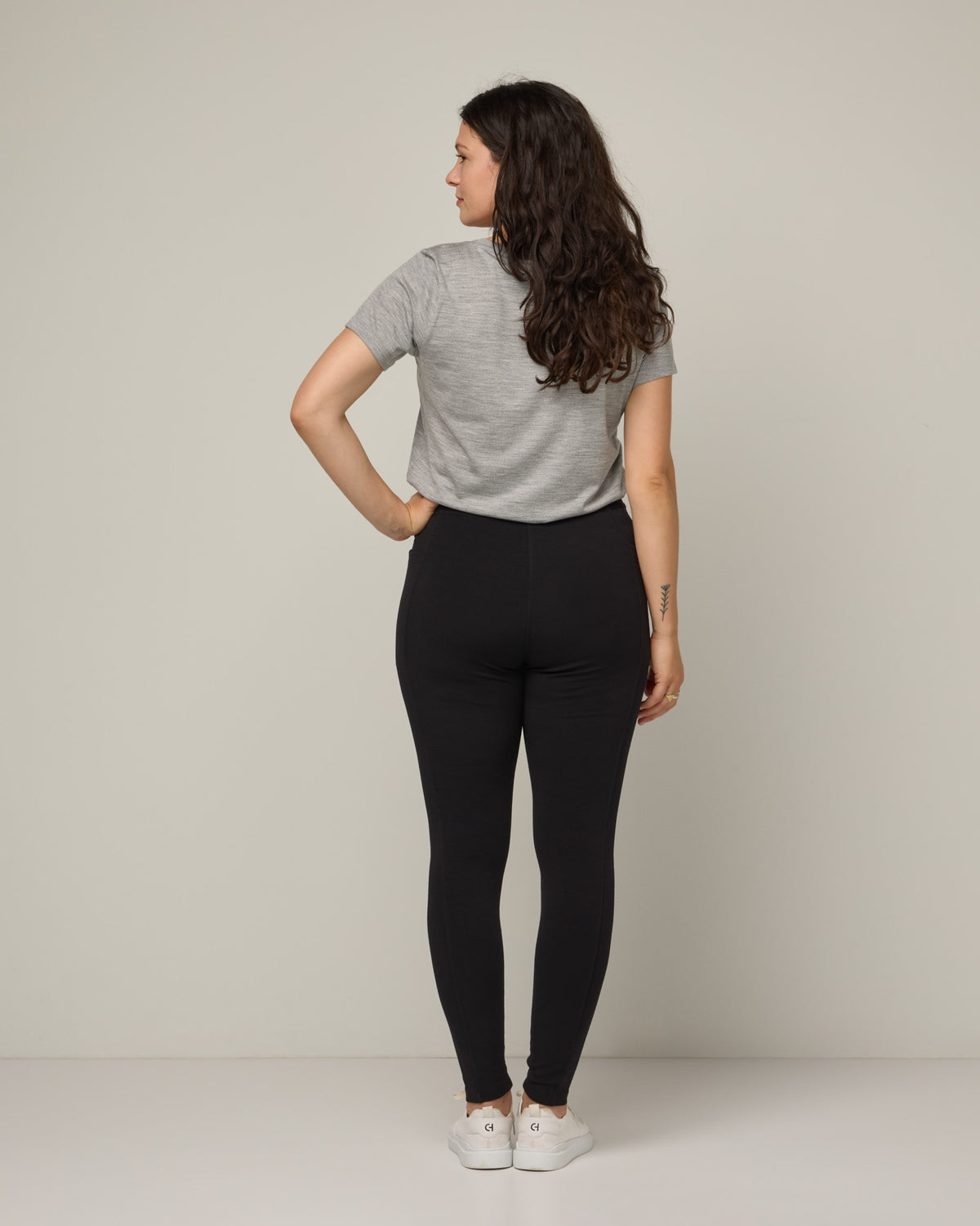 Model wearing Terra Ponte Legging in Black. Terra Ponte Legging is a merino wool legging with pockets available in sizes XS-3X Regular, S-XXL Long.
