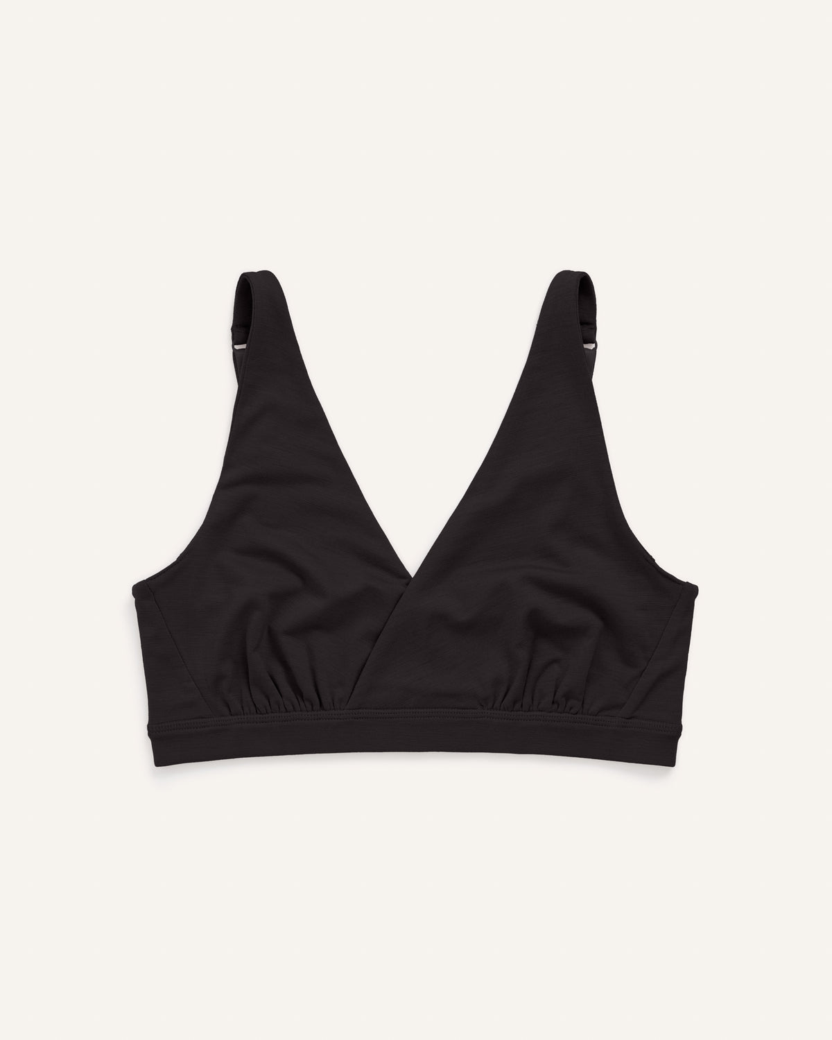 Model wearing Roam Convertible Wrap Bra in Black. Roam Convertible Wrap Bra is a merino wool underwear available in sizes XS-XXL.