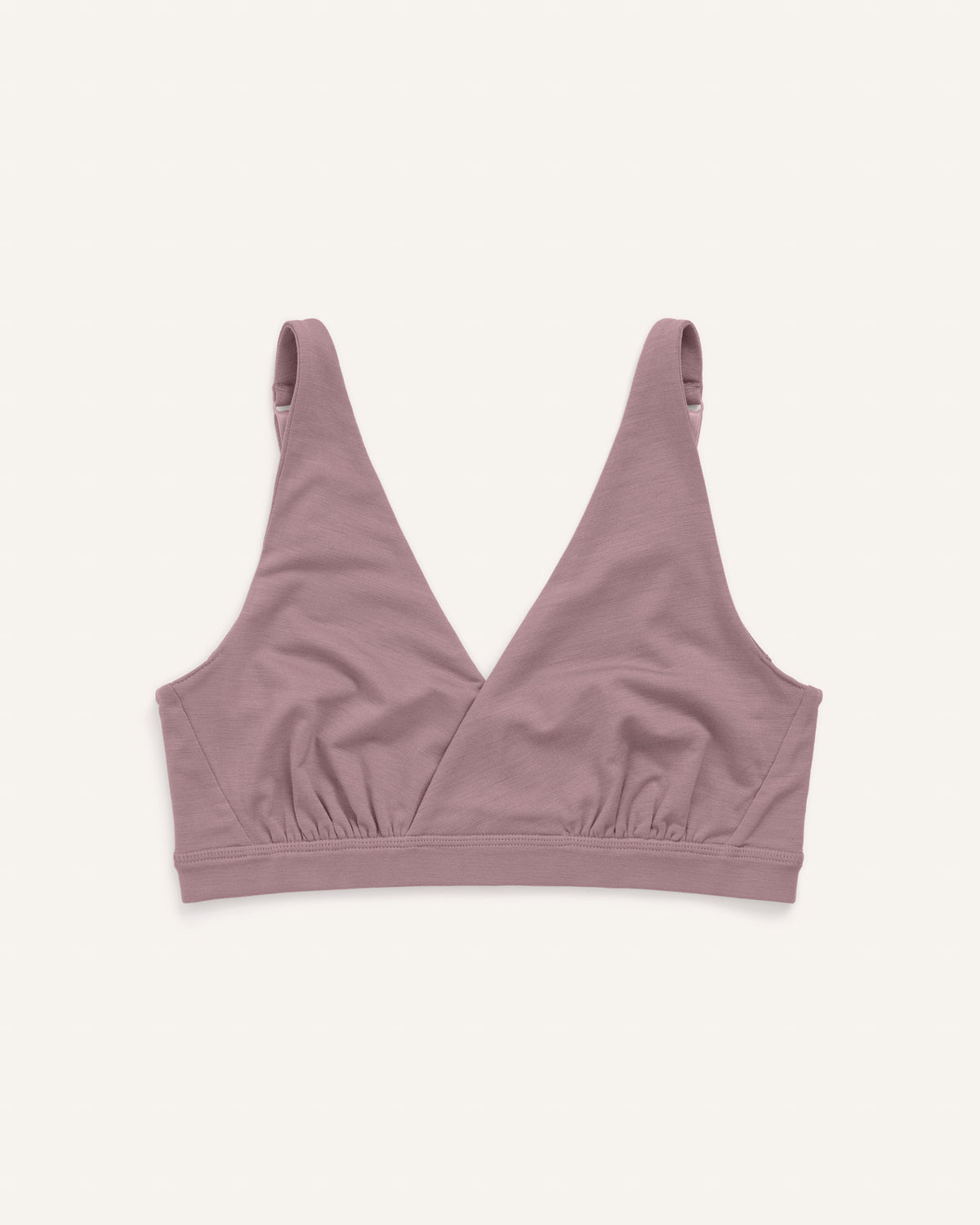 Laydown of Roam Convertible Wrap Bra in Lavender, a dusky, muted purple color. Roam Convertible Wrap Bra is a merino wool underwear available in sizes XS-XXL.