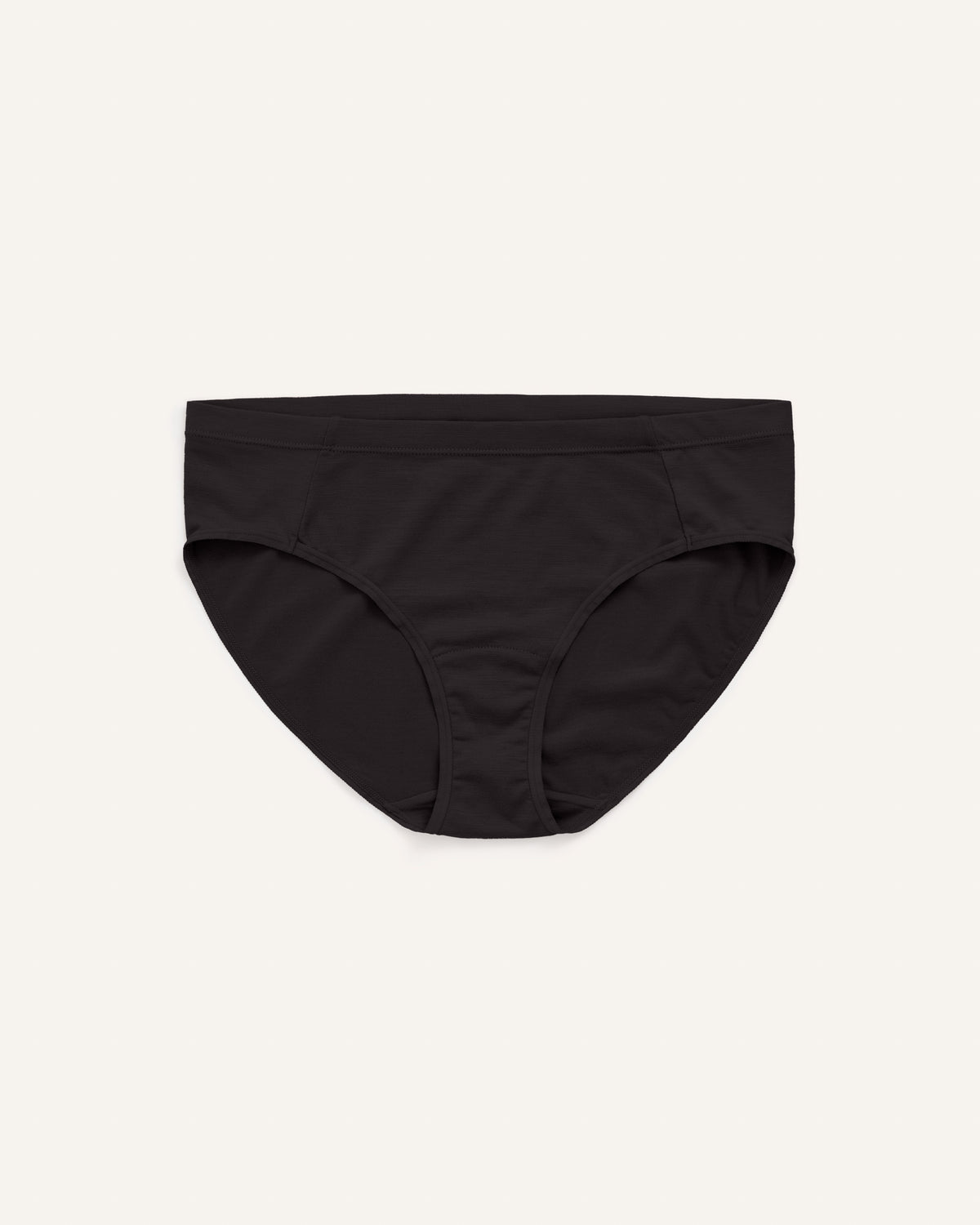 Model wearing Roam Bikini in Black. Roam Bikini is a merino wool underwear available in sizes XS-3X.