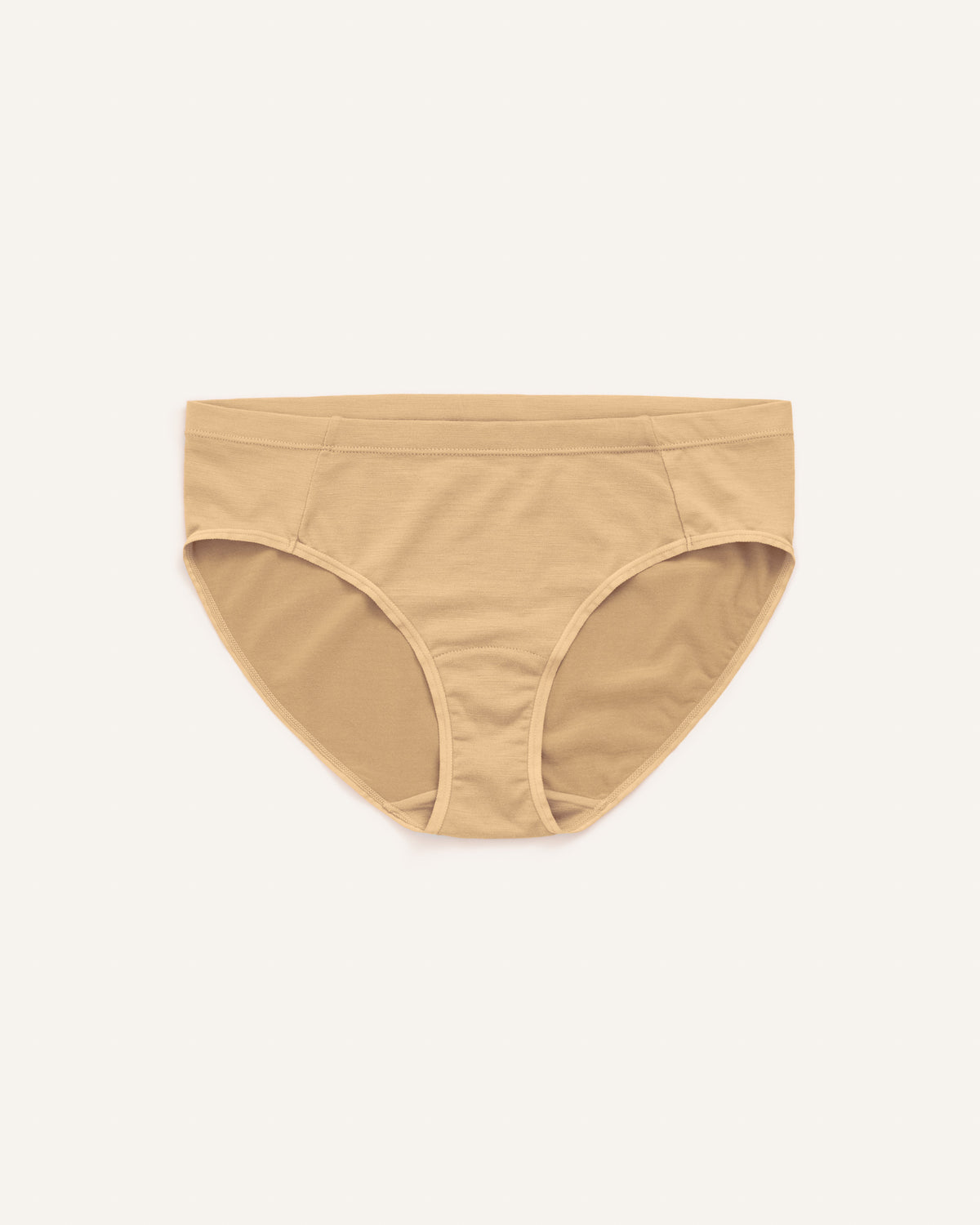 Laydown of Roam Bikini in Fawn, a light nude color. Roam Bikini is a merino wool underwear available in sizes XS-3X.