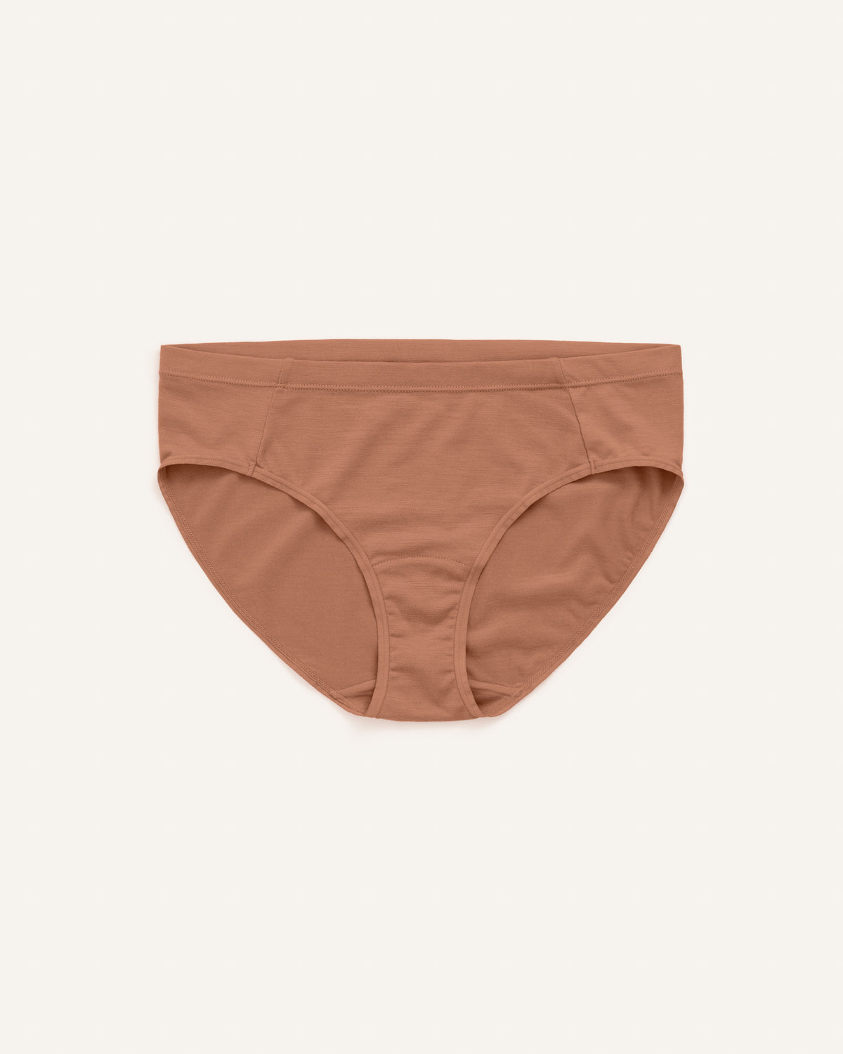 Laydown of Roam Bikini in Mocha Brown, a medium-dark nude color. Roam Bikini is a merino wool underwear available in sizes XS-3X.