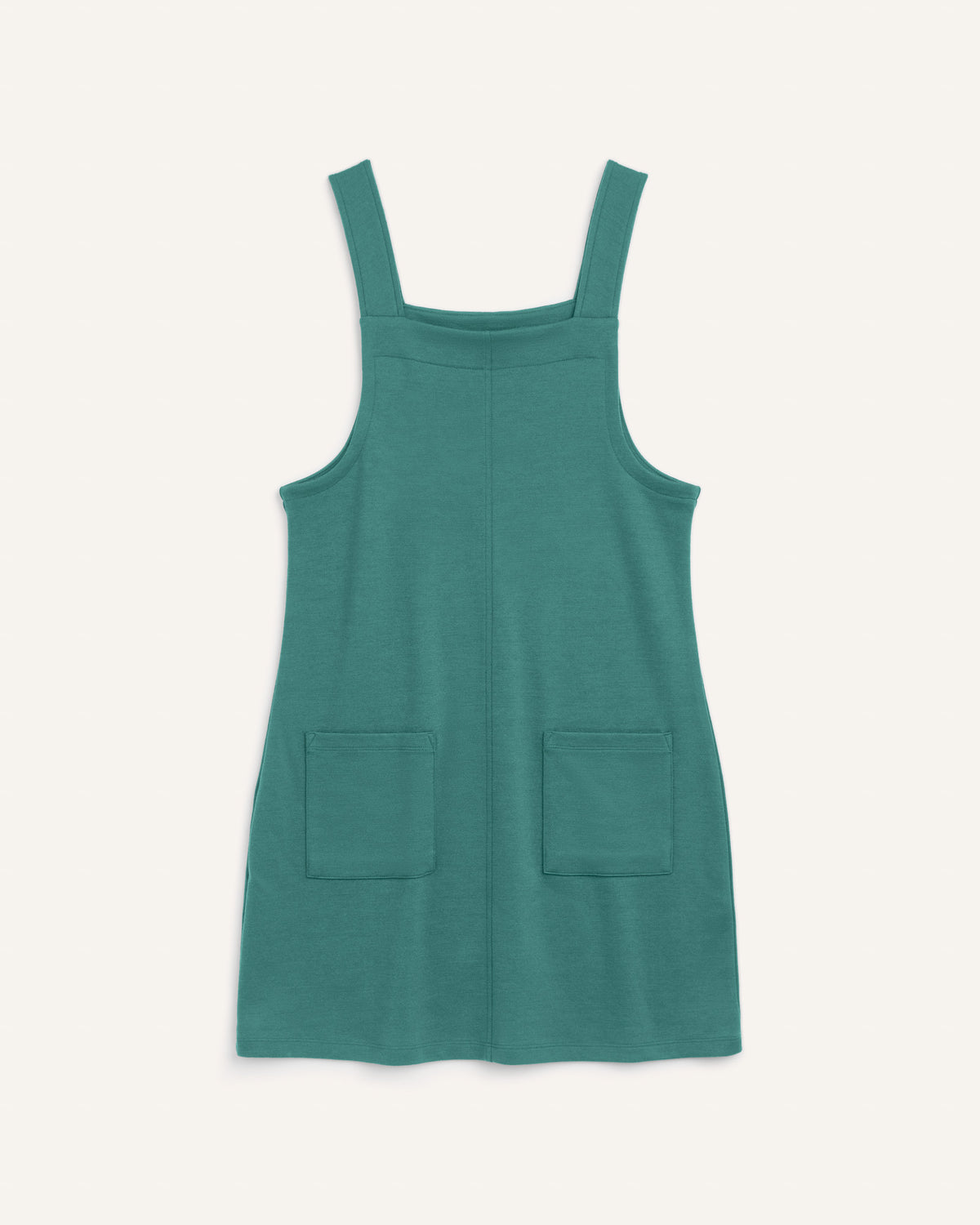 Laydown of Goldie Pinafore Dress in Silver Jade, a soft green-blue color. Goldie Pinafore Dress is a merino wool sleeveless, square neck, knee length shift dress with pockets available in sizes XS-3X.