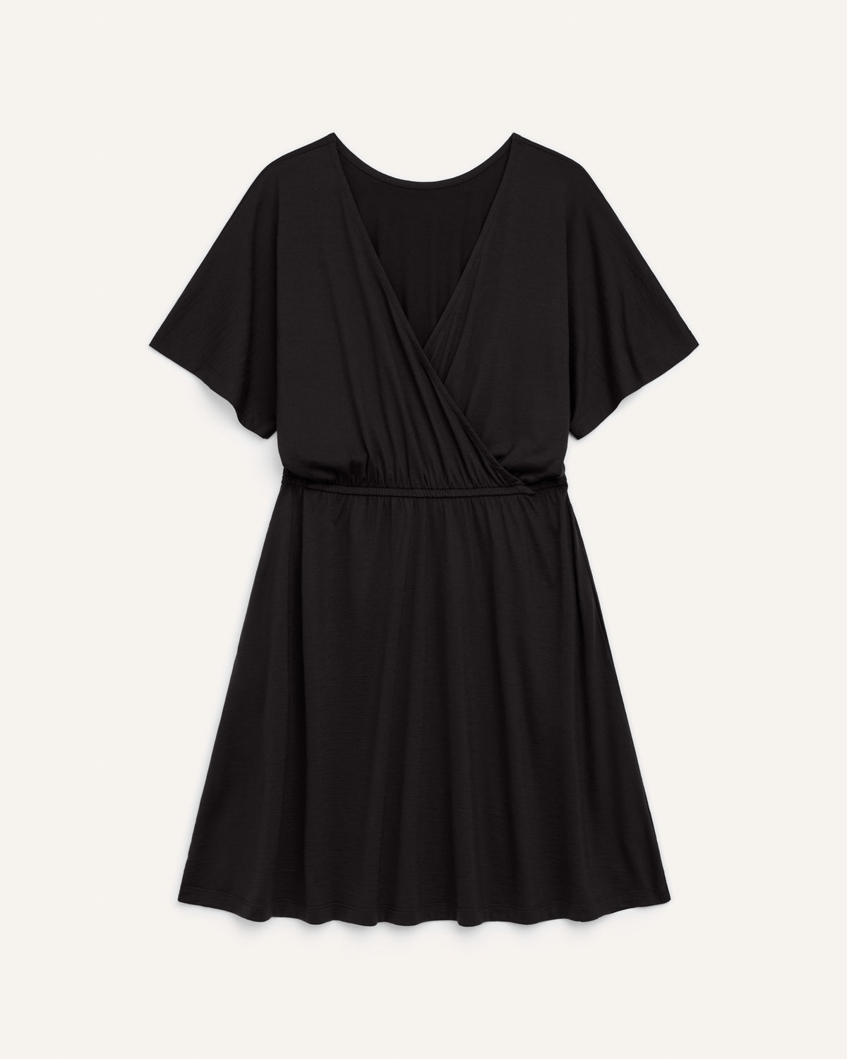 Laydown of Brooklyn Reversible Dress in Black. Brooklyn Reversible Dress is a merino wool short sleeve, reversible, knee length fit & flare dress with pockets available in sizes XS-3X Regular, XS-XL Long.