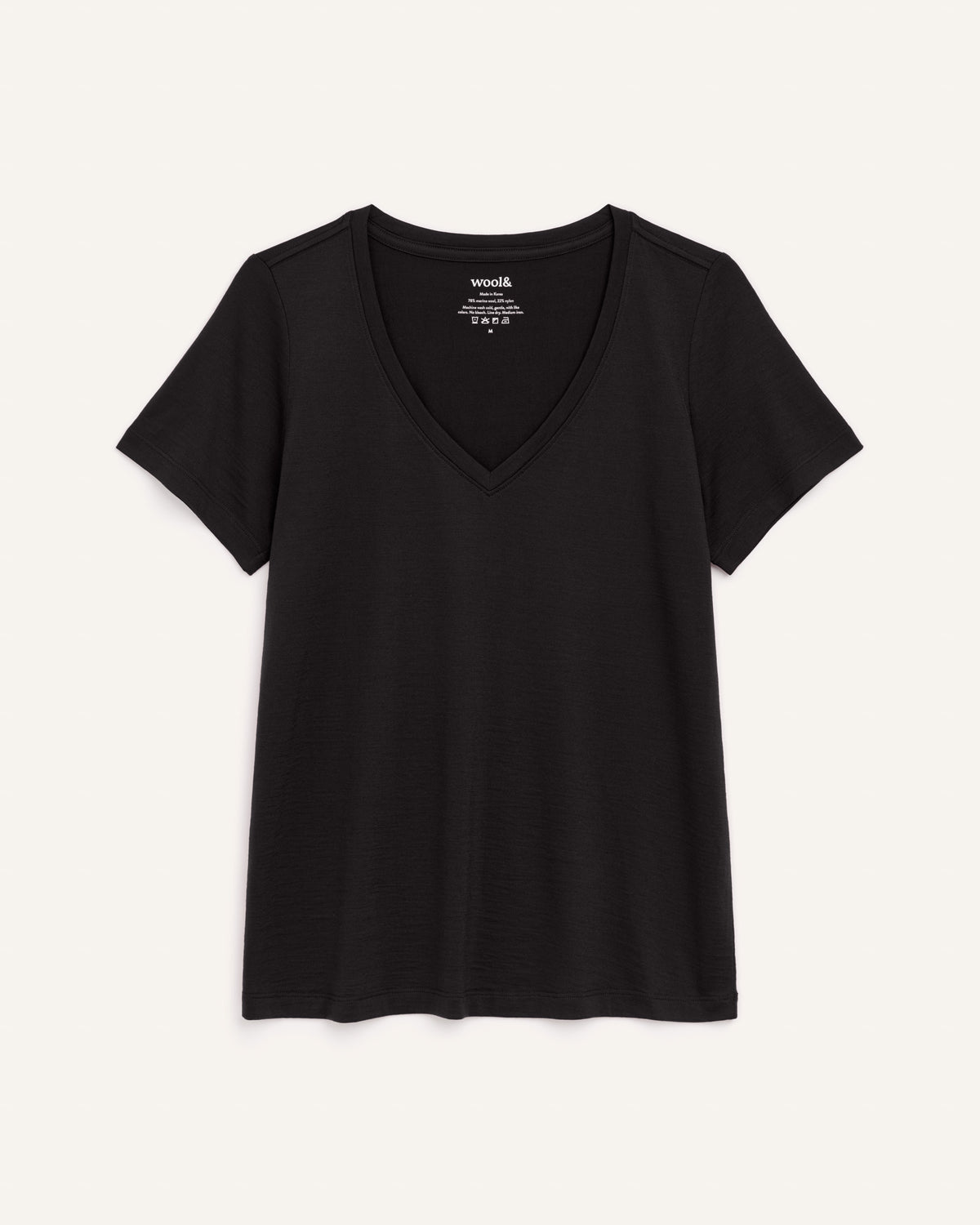 Laydown of Morgan V-Neck Tee in Black. Morgan V-Neck Tee is a merino wool short sleeve, v-neck, regular fit tee available in sizes XS-3X.