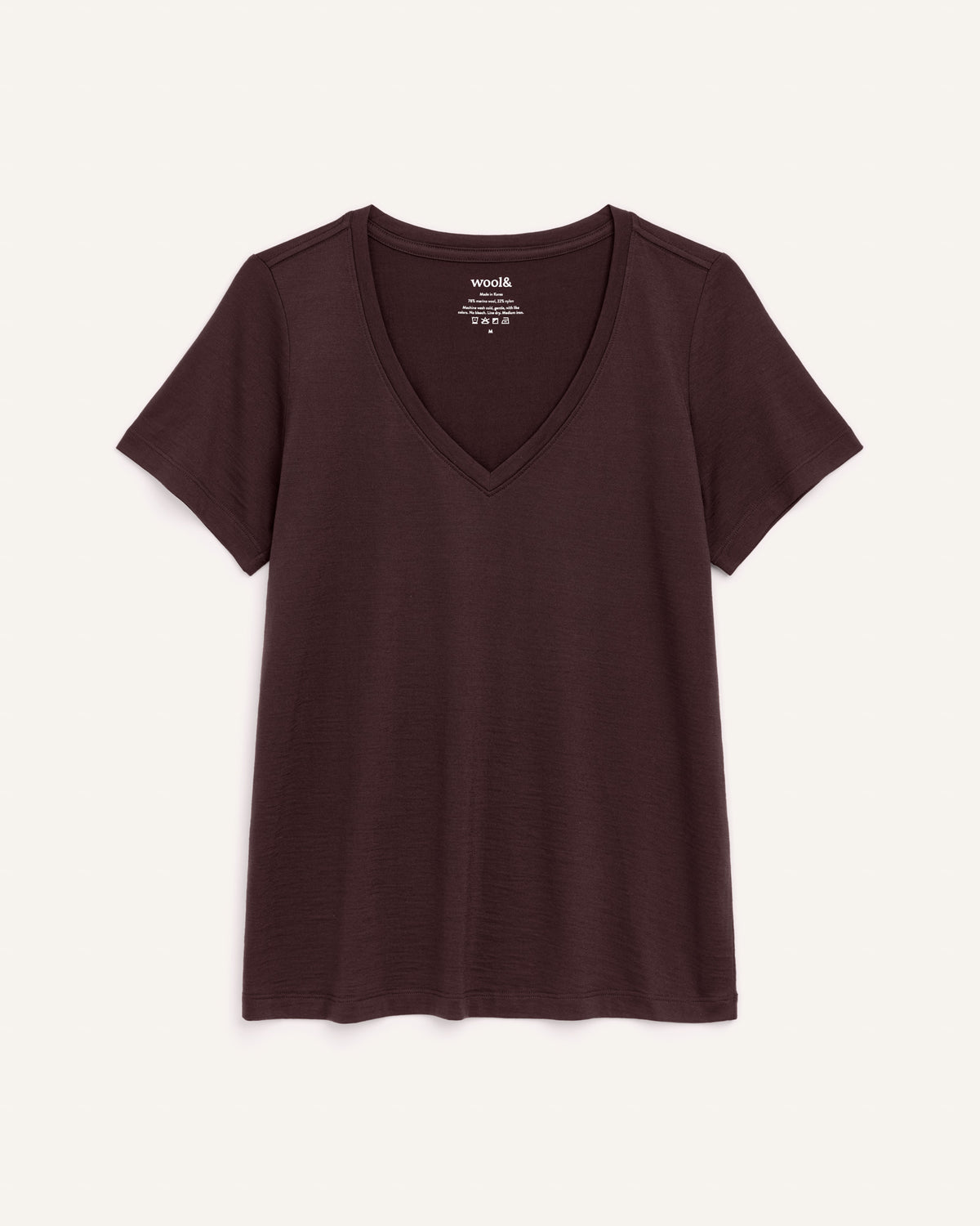Laydown of Morgan V-Neck Tee in Espresso, a warm dark brown color. Morgan V-Neck Tee is a merino wool short sleeve, v-neck, regular fit tee available in sizes XS-3X.