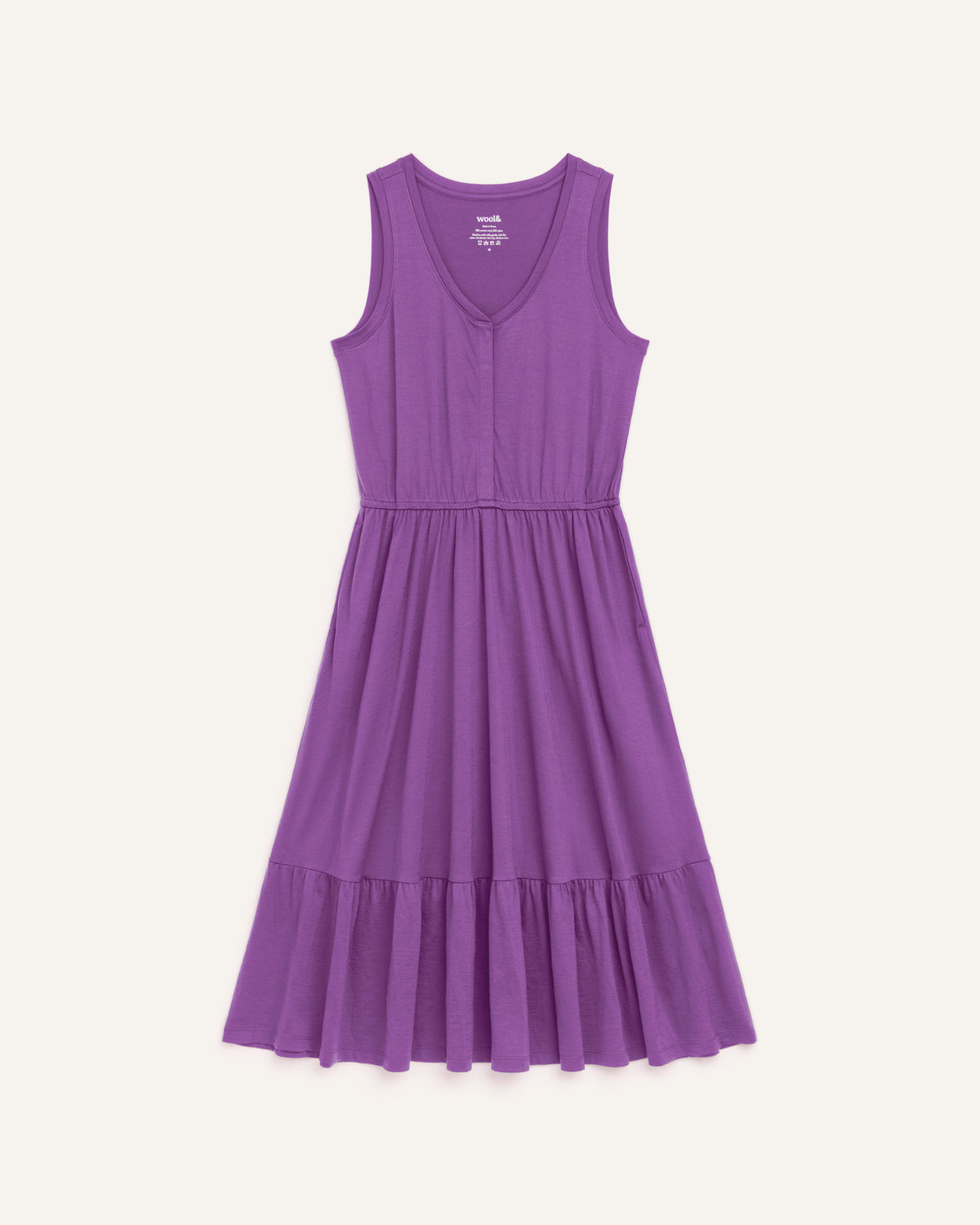 Laydown of Grace Tiered Dress in Purple Pansy, a bright, saturated purple color. Grace Tiered Dress is a merino wool sleeveless, scoop neck, midi fit & flare dress with pockets available in sizes XS-3X.