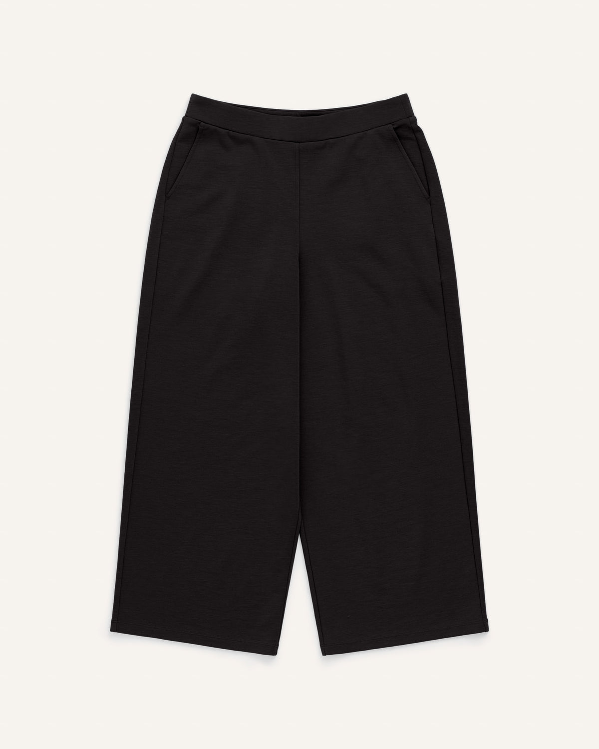 Laydown of Frame Ponte Culotte in Black. Frame Ponte Culotte is a merino wool pant with pockets available in sizes XS-3X Regular, XS-XL Petite.