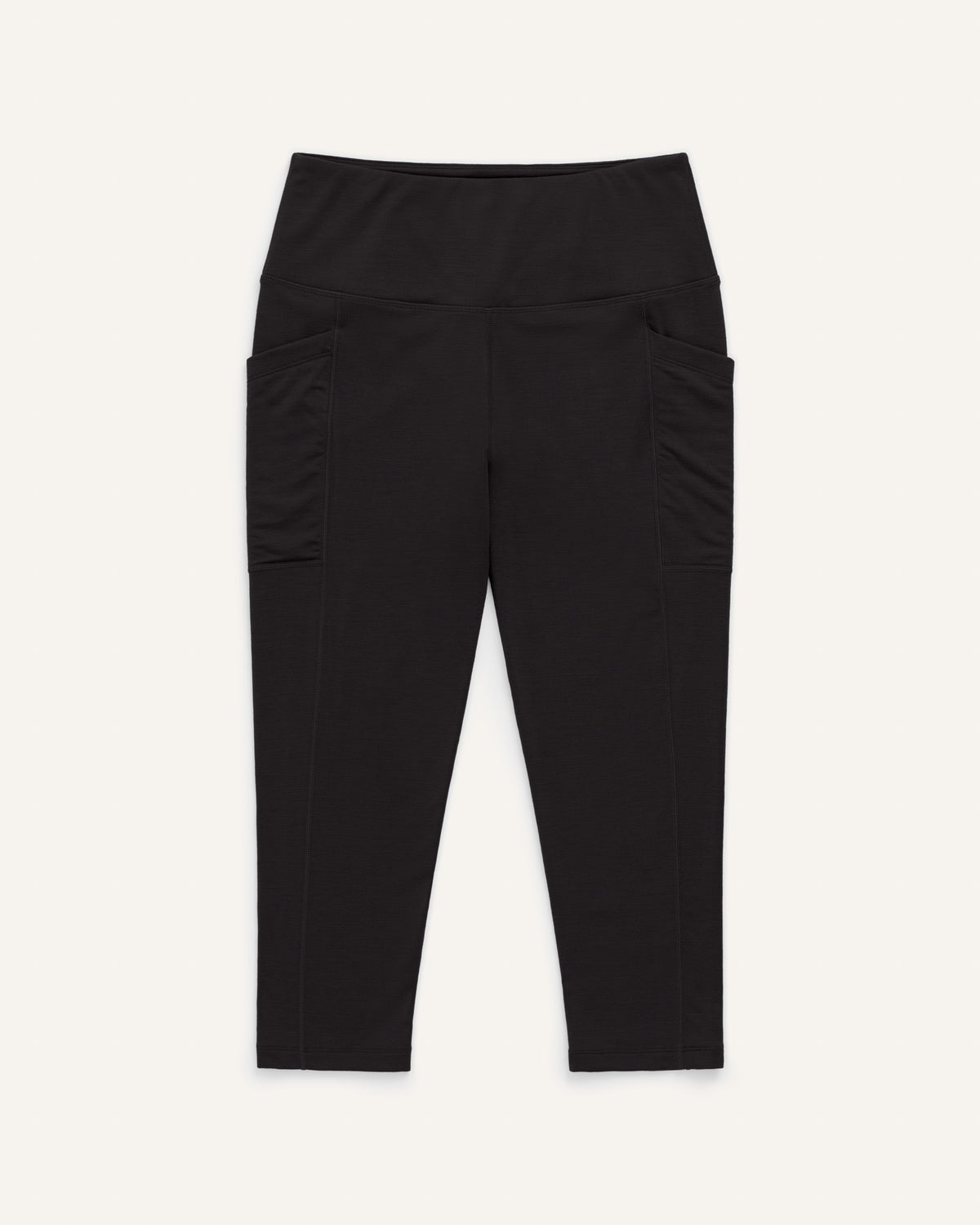 Laydown of Summit Pocket Crop Legging in Black. Summit Pocket Crop Legging is a merino wool legging with pockets available in sizes XS-3X.
