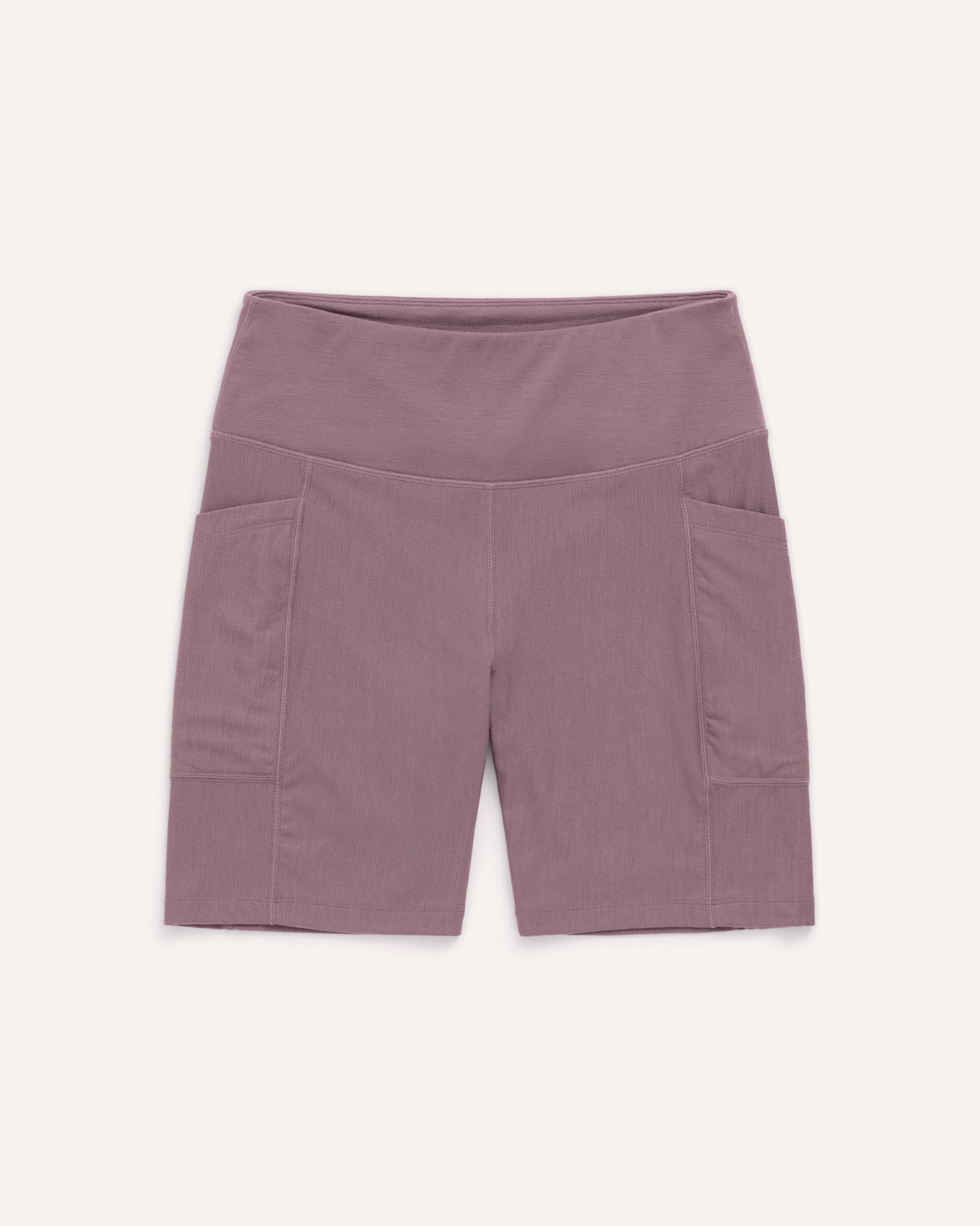 Laydown of Summit Pocket Bike Short in Lavender, a dusky muted purple color. Summit Pocket Bike Short is a merino wool short with pockets available in sizes XS-3X.