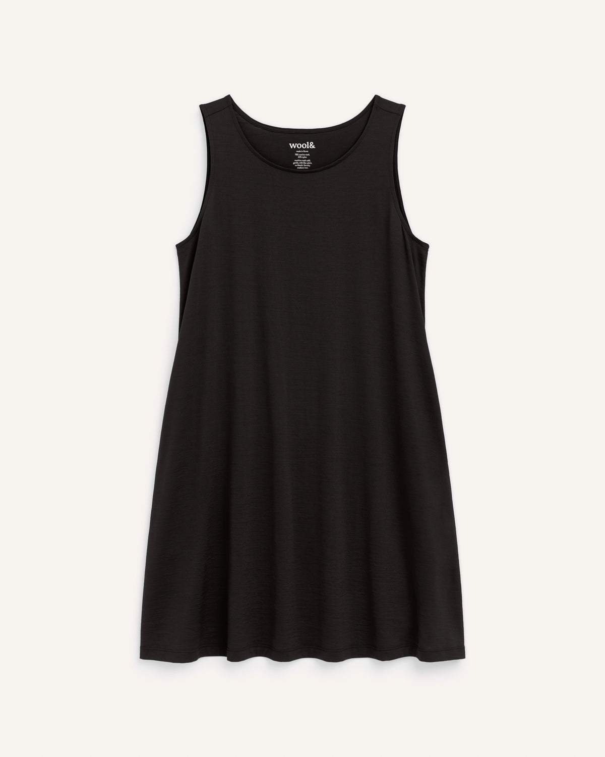 Laydown of Camellia Tank Dress in Black. Camellia Tank Dress is a merino wool sleeveless, crew neck, knee length swing dress with pockets available in sizes XS-3X Regular, XS-3X Long.