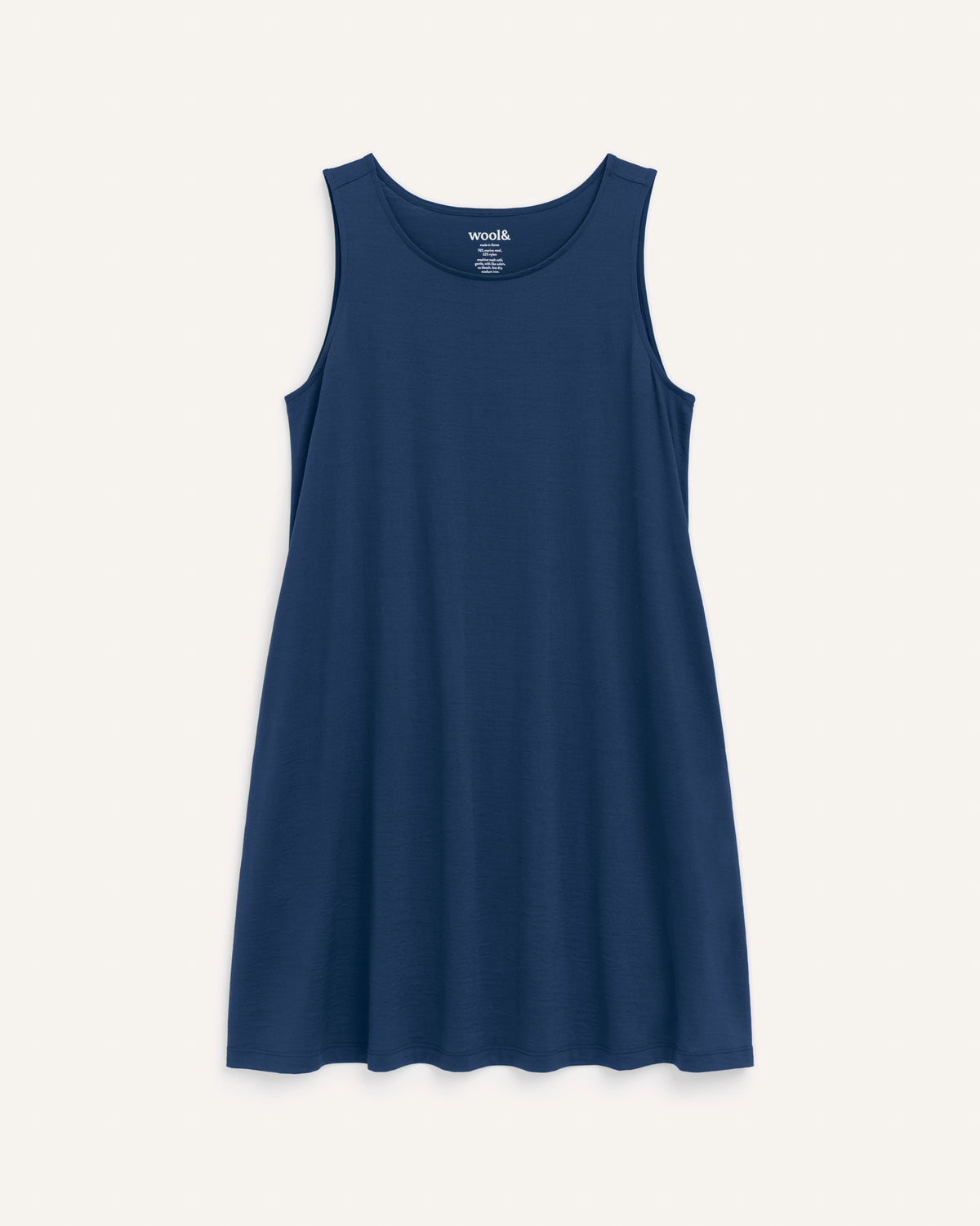 Laydown of Camellia Tank Dress in Marine Blue, a deep royal blue color. Camellia Tank Dress is a merino wool sleeveless, crew neck, knee length swing dress with pockets available in sizes XS-3X Regular, XS-3X Long.