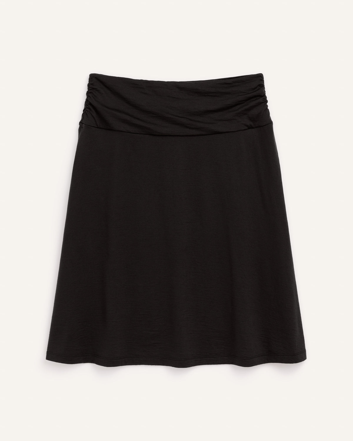Laydown of Helena Skirt in Black. Helena Skirt is a merino wool knee length skirt with pockets available in sizes XS-3X.