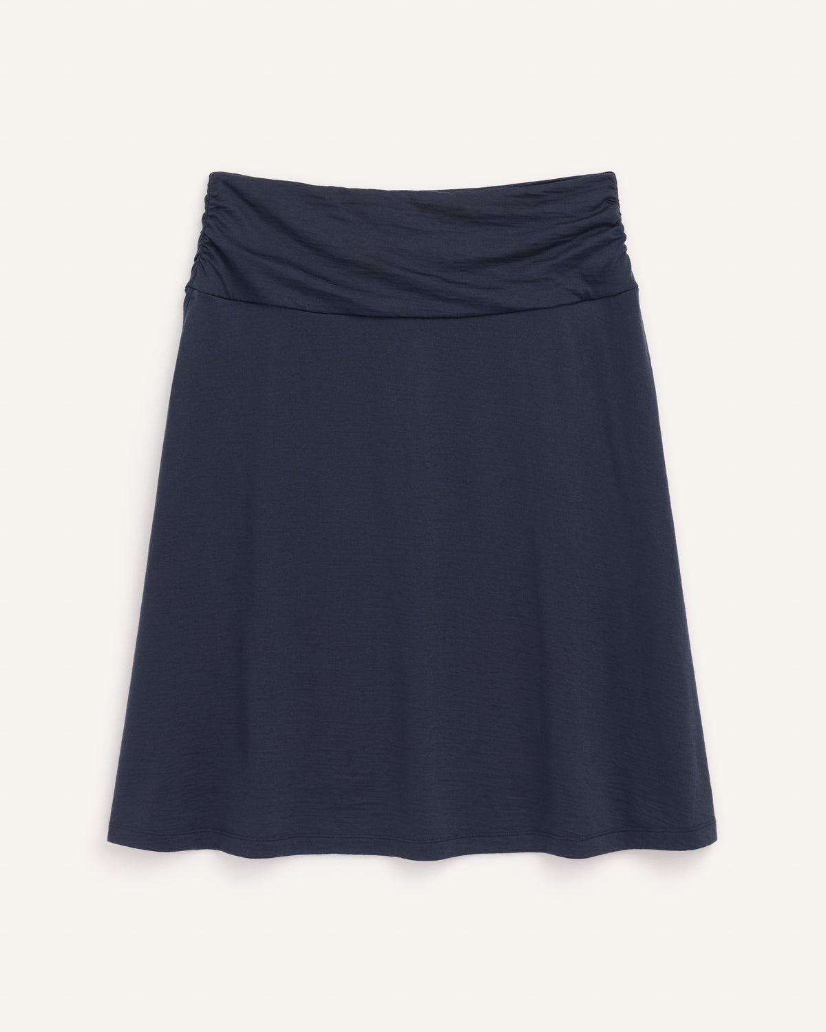 Laydown of Helena Skirt in Washed Navy. Helena Skirt is a merino wool knee length skirt with pockets available in sizes XS-3X.