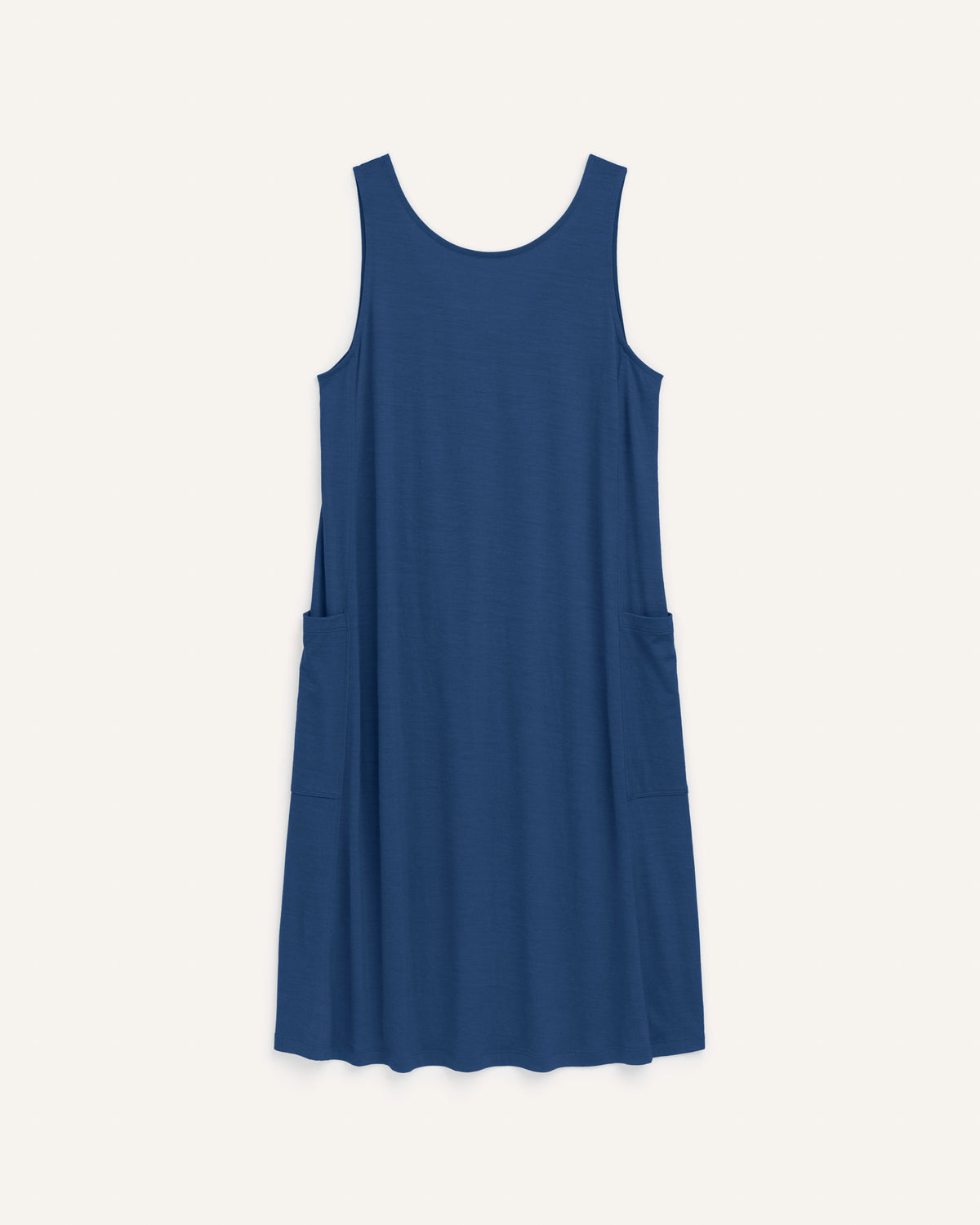 Laydown of Summer Reversible Dress in Marine Blue, a deep royal blue color. Summer Reversible Dress is a merino wool sleeveless, reversible, midi swing dress with pockets available in sizes XS-3X.