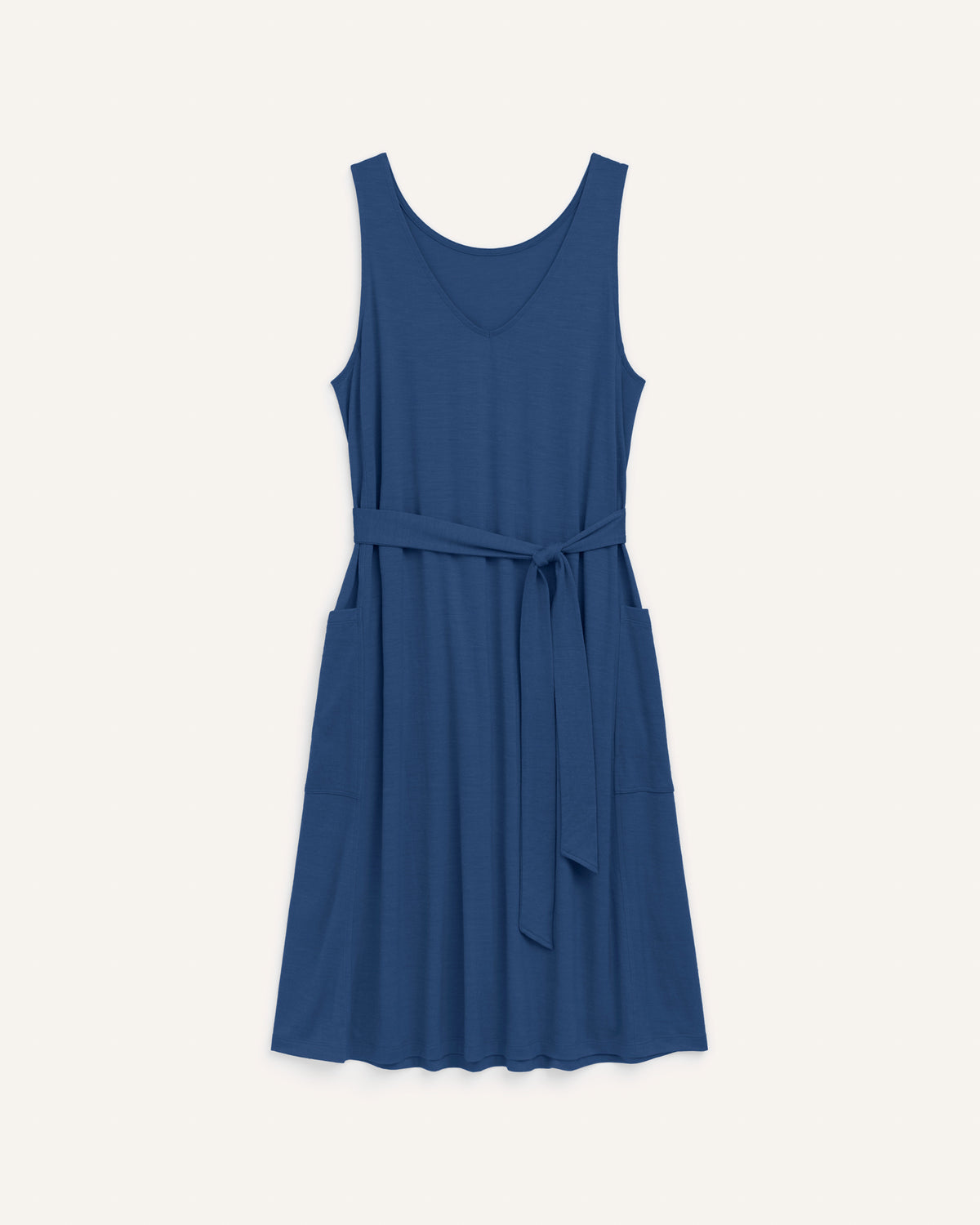 Laydown of Summer Reversible Dress in Marine Blue, a deep royal blue color. Summer Reversible Dress is a merino wool sleeveless, reversible, midi swing dress with pockets available in sizes XS-3X.