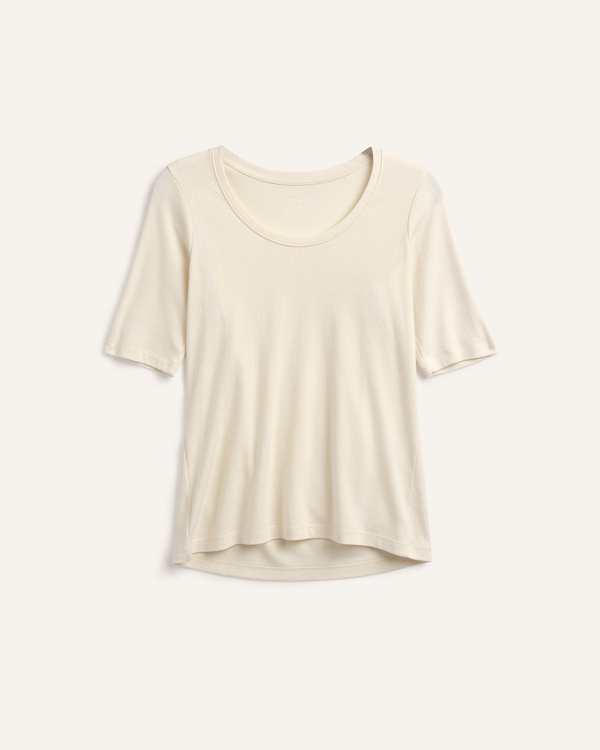 Laydown of Celine Ribbed Elbow Sleeve Tee in Natural White, an off-white cream color. Celine Ribbed Elbow Sleeve Tee is a merino wool short sleeve, scoop neck, slim fit tee available in sizes XS-3X.