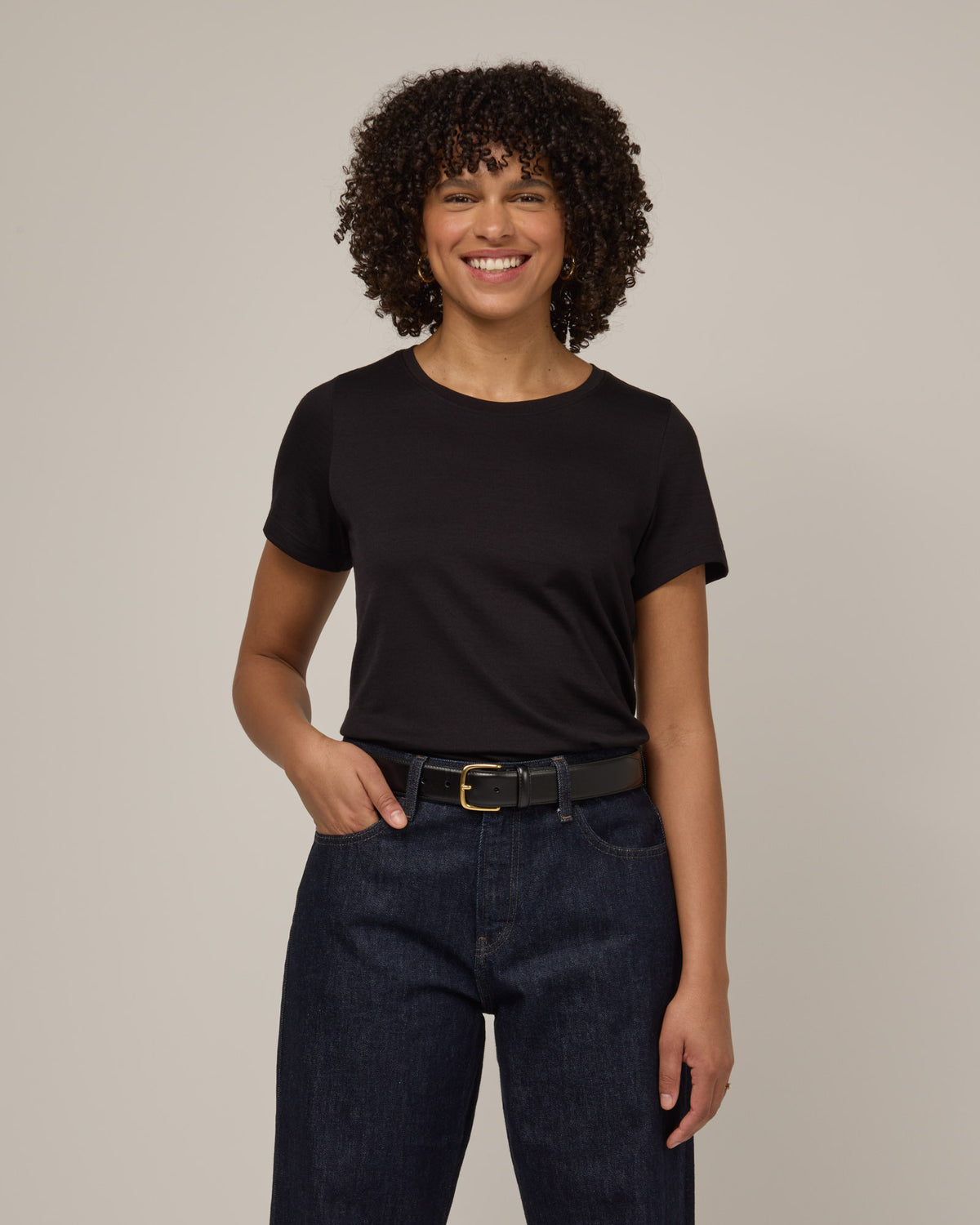 Model wearing Zoe Easy Crew Neck Tee in Black. Zoe Easy Crew Neck Tee is a merino wool short sleeve, crew neck, regular fit tee available in sizes XS-3X.