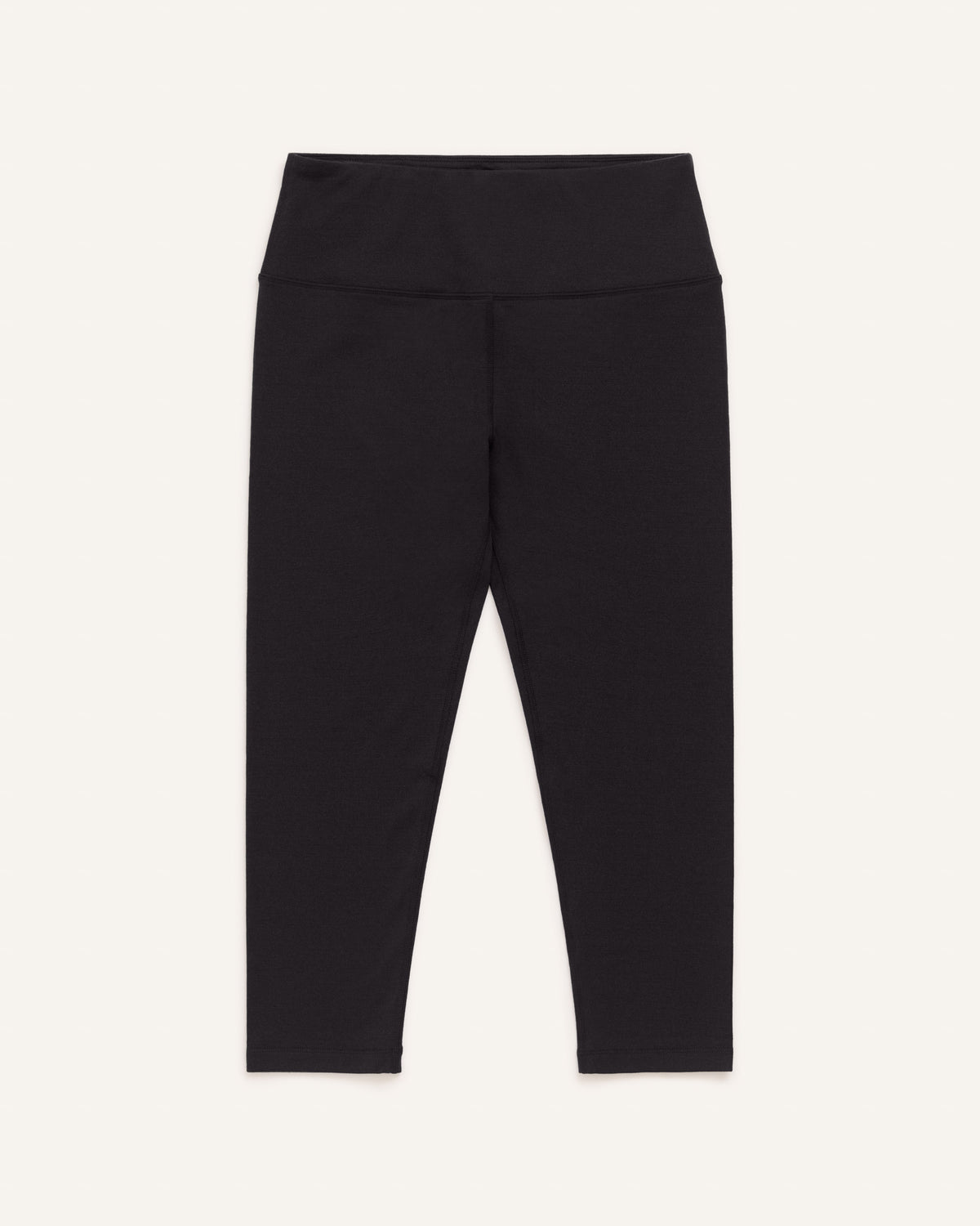 Laydown of Summit Crop Legging in Black. Summit Crop Legging is a merino wool legging available in sizes XS-3X.