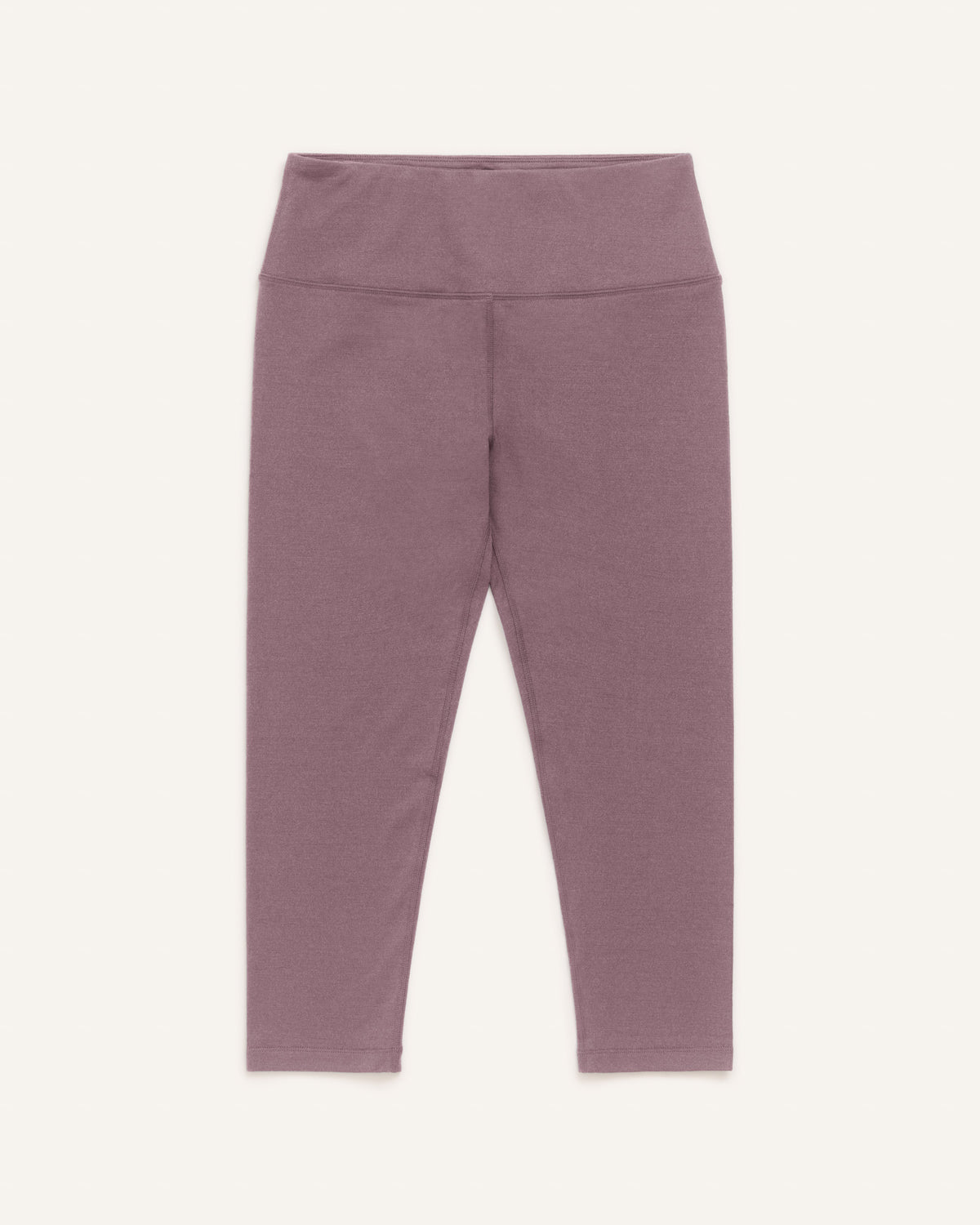 Laydown of Summit Crop Legging in Lavender, a dusky muted purple color. Summit Crop Legging is a merino wool legging available in sizes XS-3X.