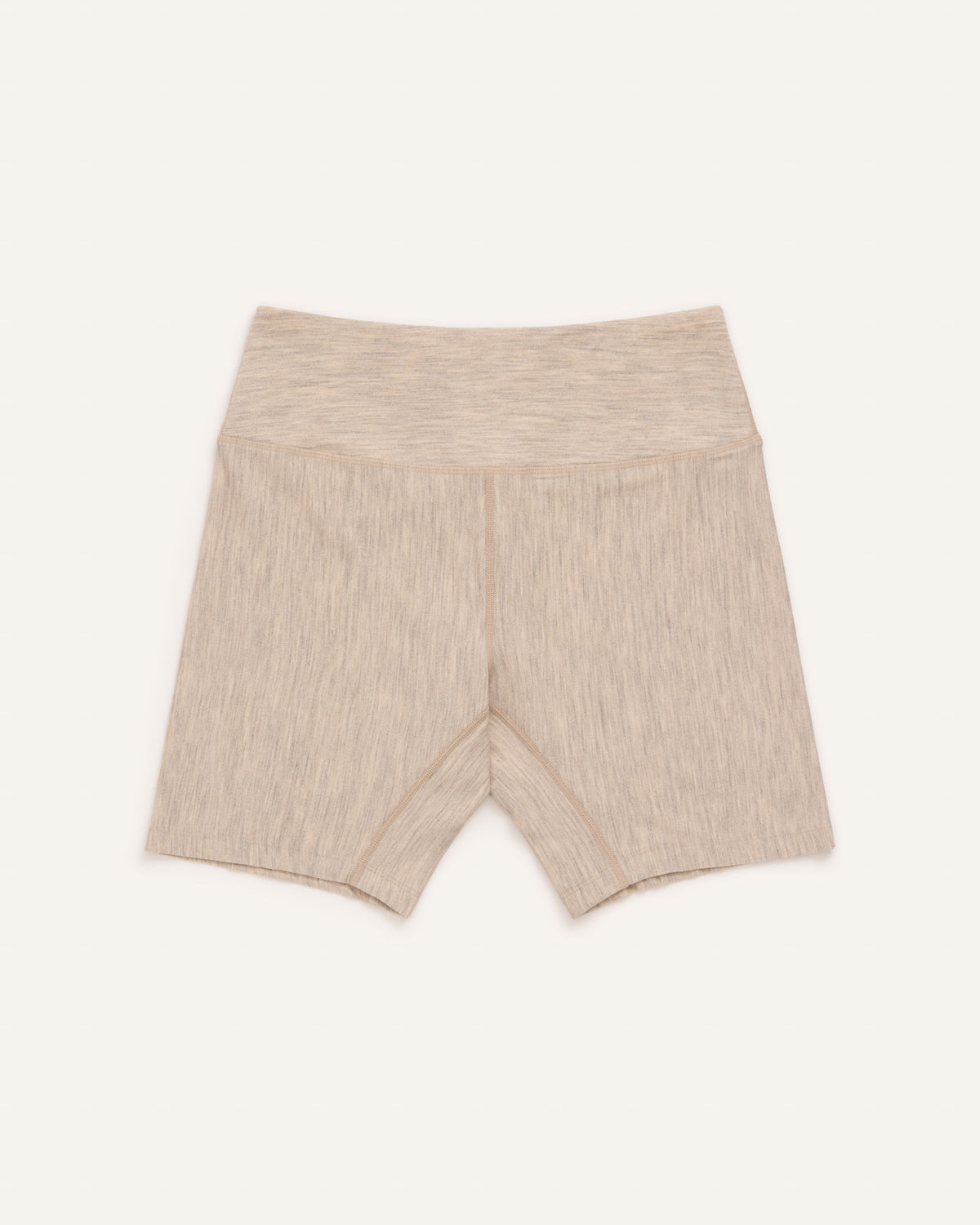 Laydown of Roam Bike Short in Oatmeal Heather, a soft heathered cream color. Roam Bike Short is a merino wool short with pockets available in sizes XS-3X.