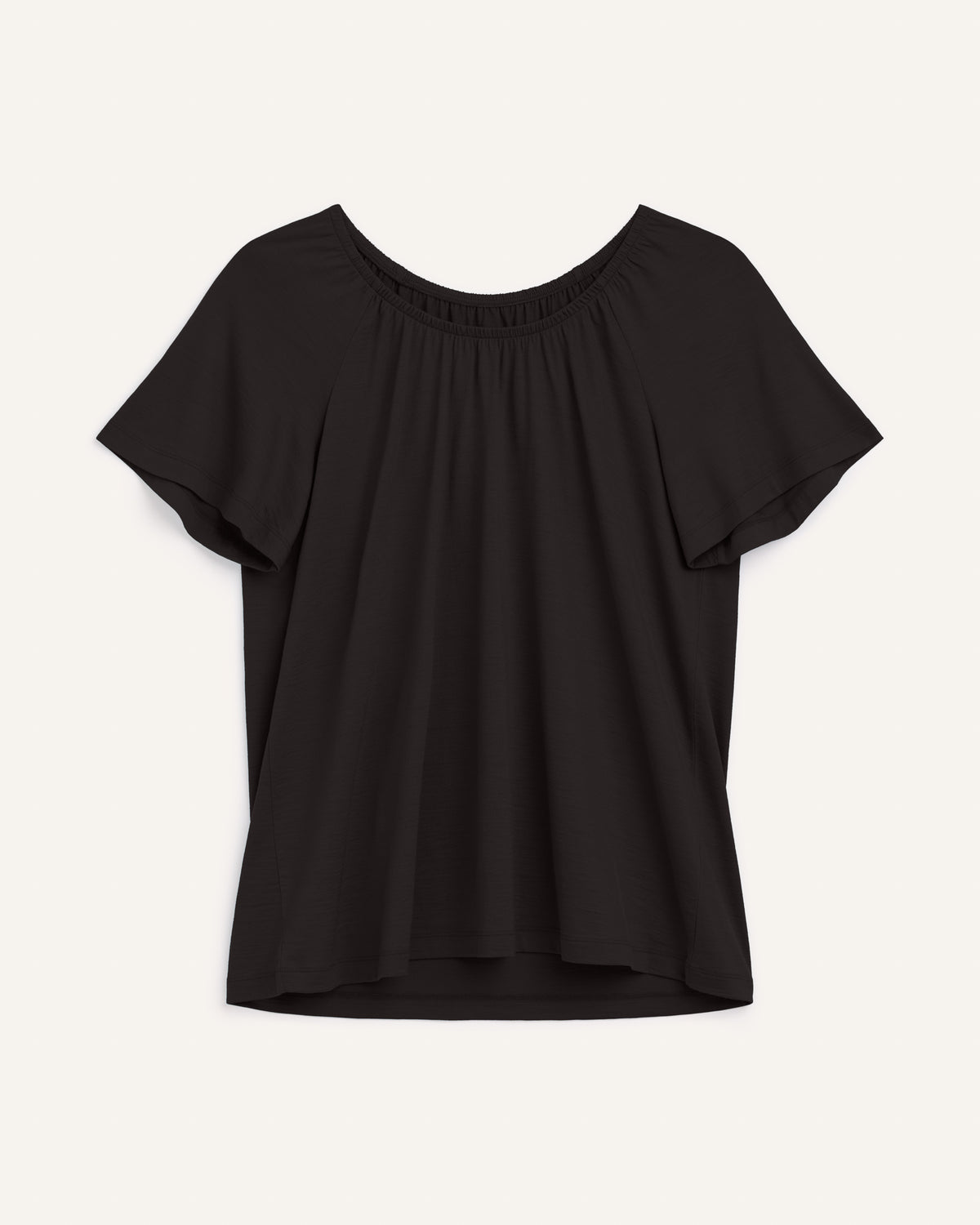 Laydown of Lilah Signature Gathered Neck Tee in Black. Lilah Signature Gathered Neck Tee is a merino wool short sleeve, scoop neck, relaxed fit tee available in sizes XS-3X.