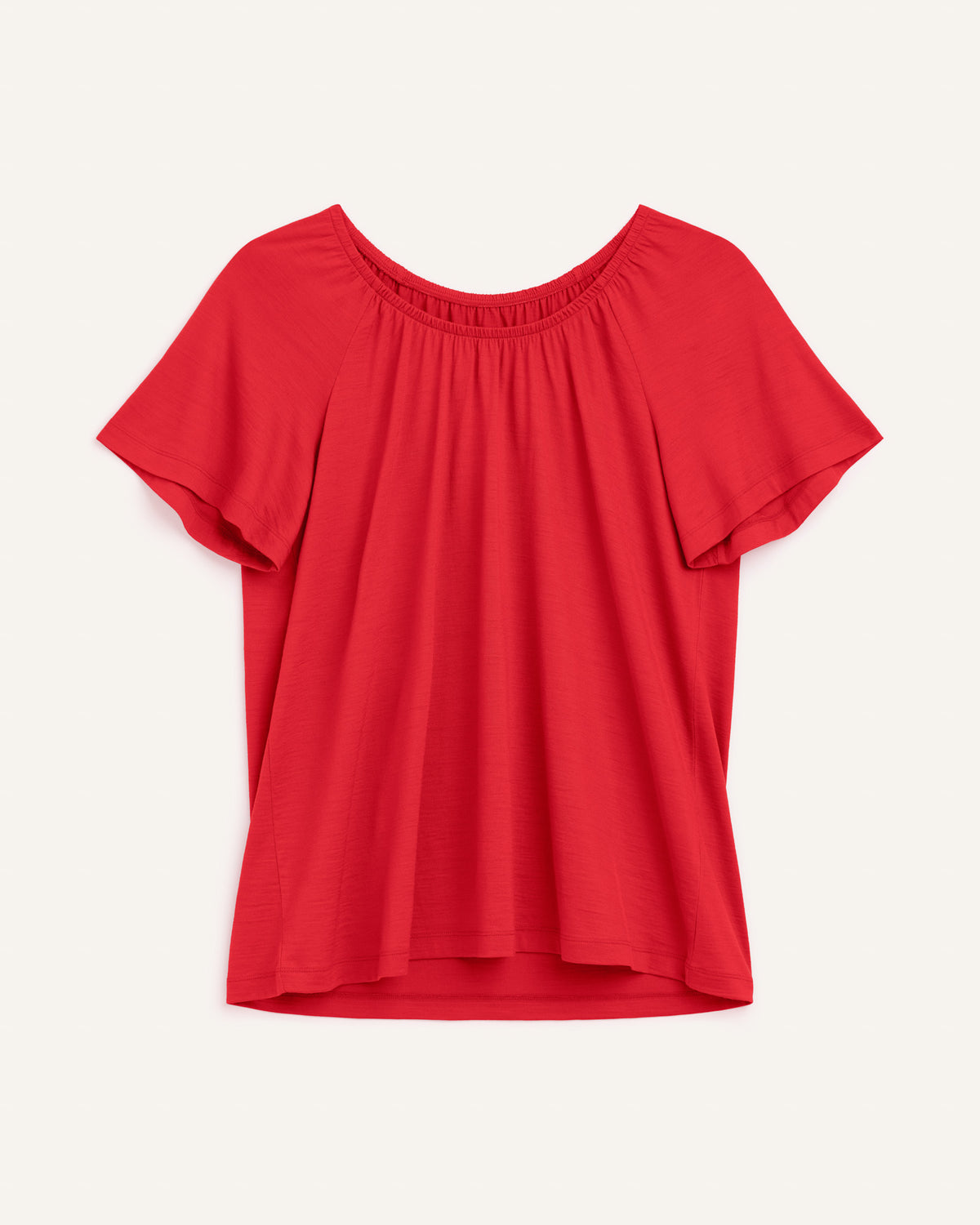 Laydown of Lilah Signature Gathered Neck Tee in Fruit Punch, a vivid red-orange color. Lilah Signature Gathered Neck Tee is a merino wool short sleeve, scoop neck, relaxed fit tee available in sizes XS-3X.