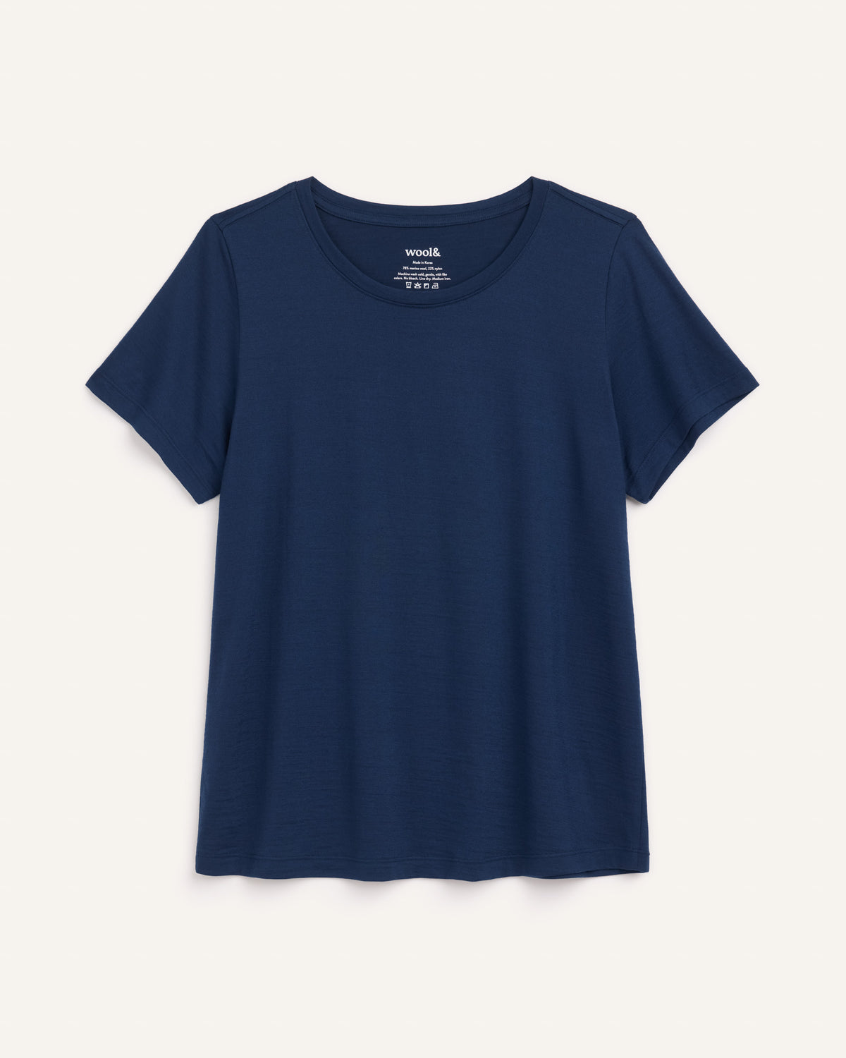Laydown of Zoe Easy Crew Neck Tee in Marine Blue, a deep royal blue color. Zoe Easy Crew Neck Tee is a merino wool short sleeve, crew neck, regular fit tee available in sizes XS-3X.