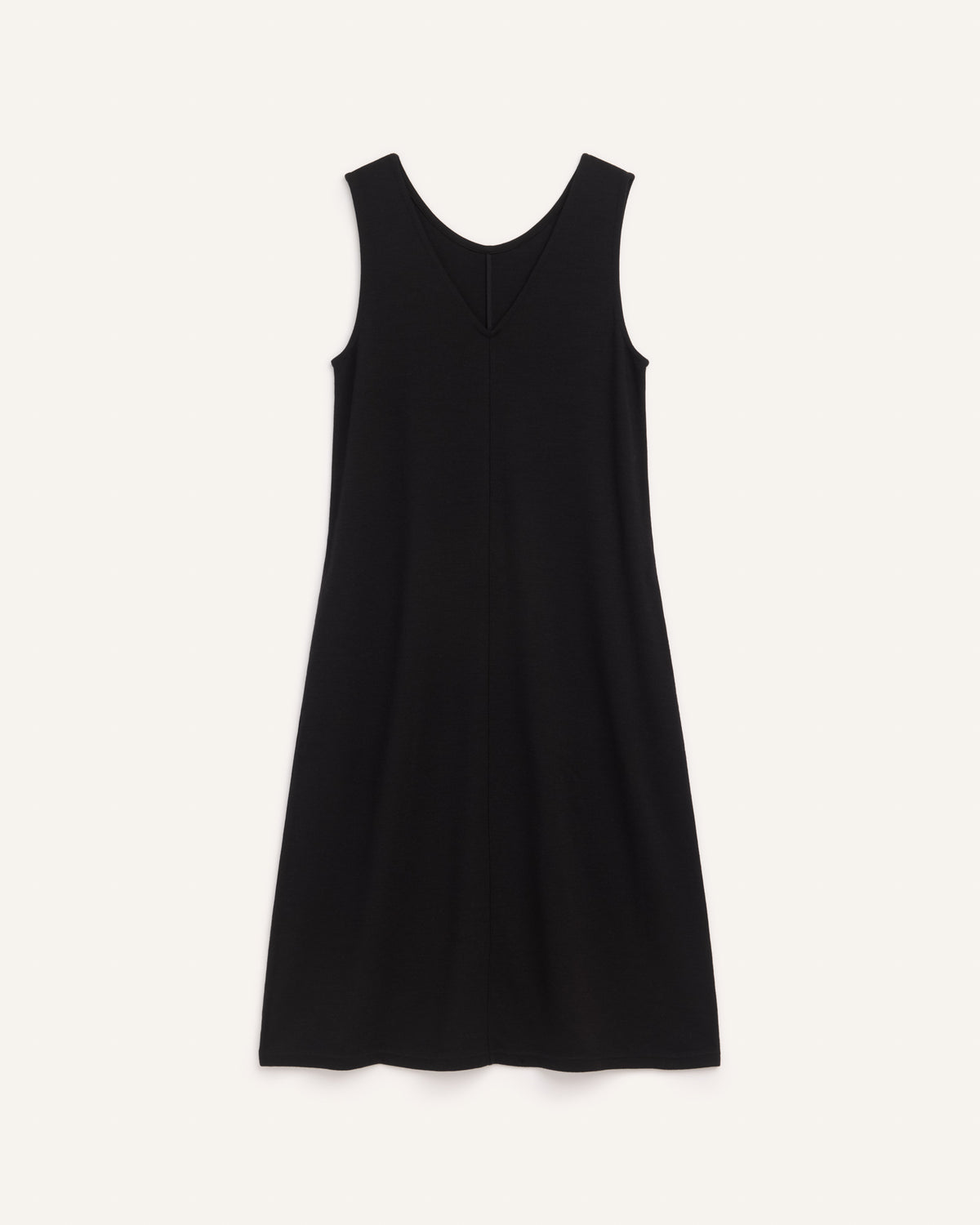 Laydown of Jessa Reversible Dress in Black. Jessa Reversible Dress is a merino wool sleeveless, reversible, midi shift dress with pockets available in sizes XS-3X.