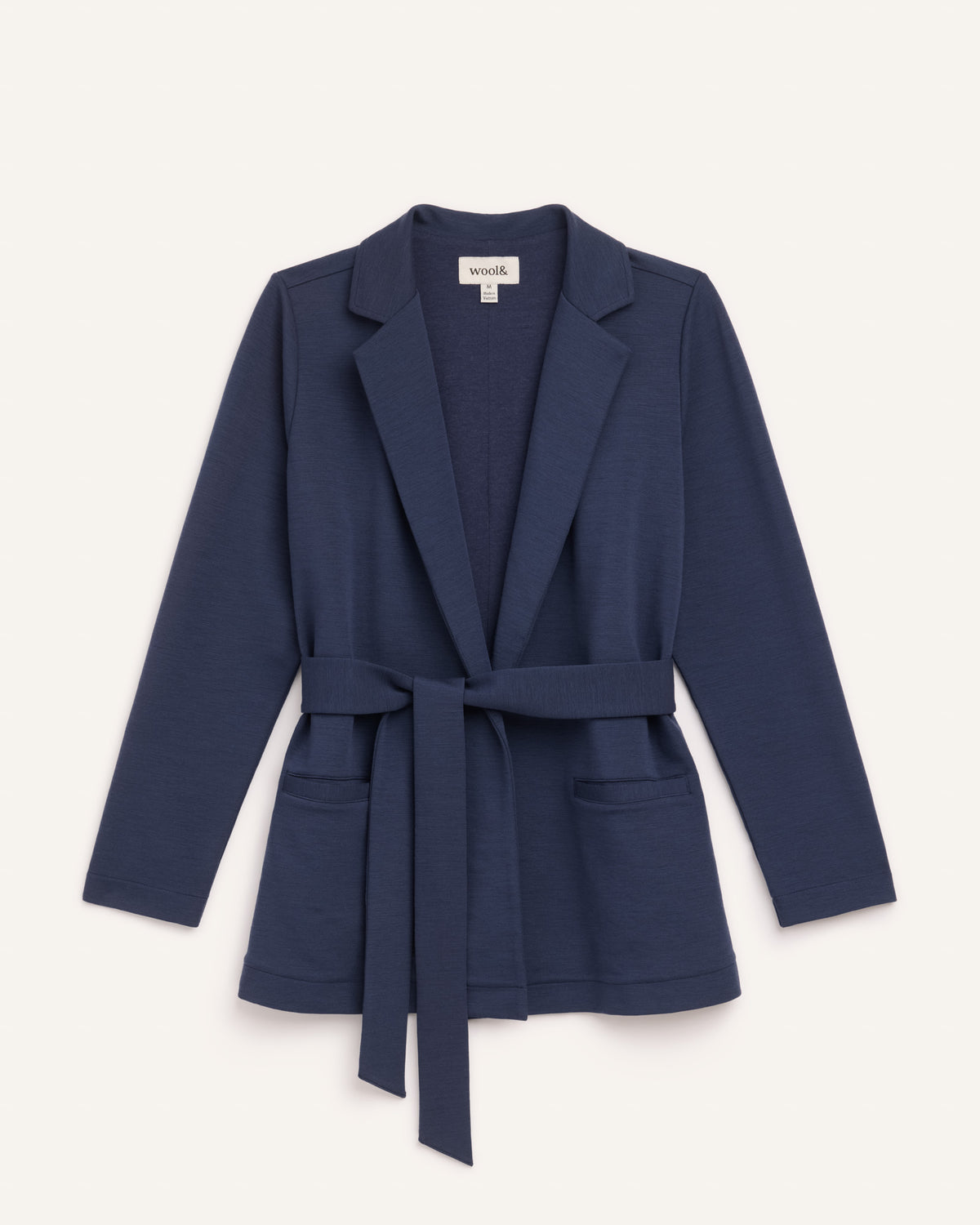 Laydown of Kristen Blazer in Washed Navy. Kristen Blazer is a merino wool long sleeve, collared, regular fit jacket with pockets available in sizes XS-XXL.