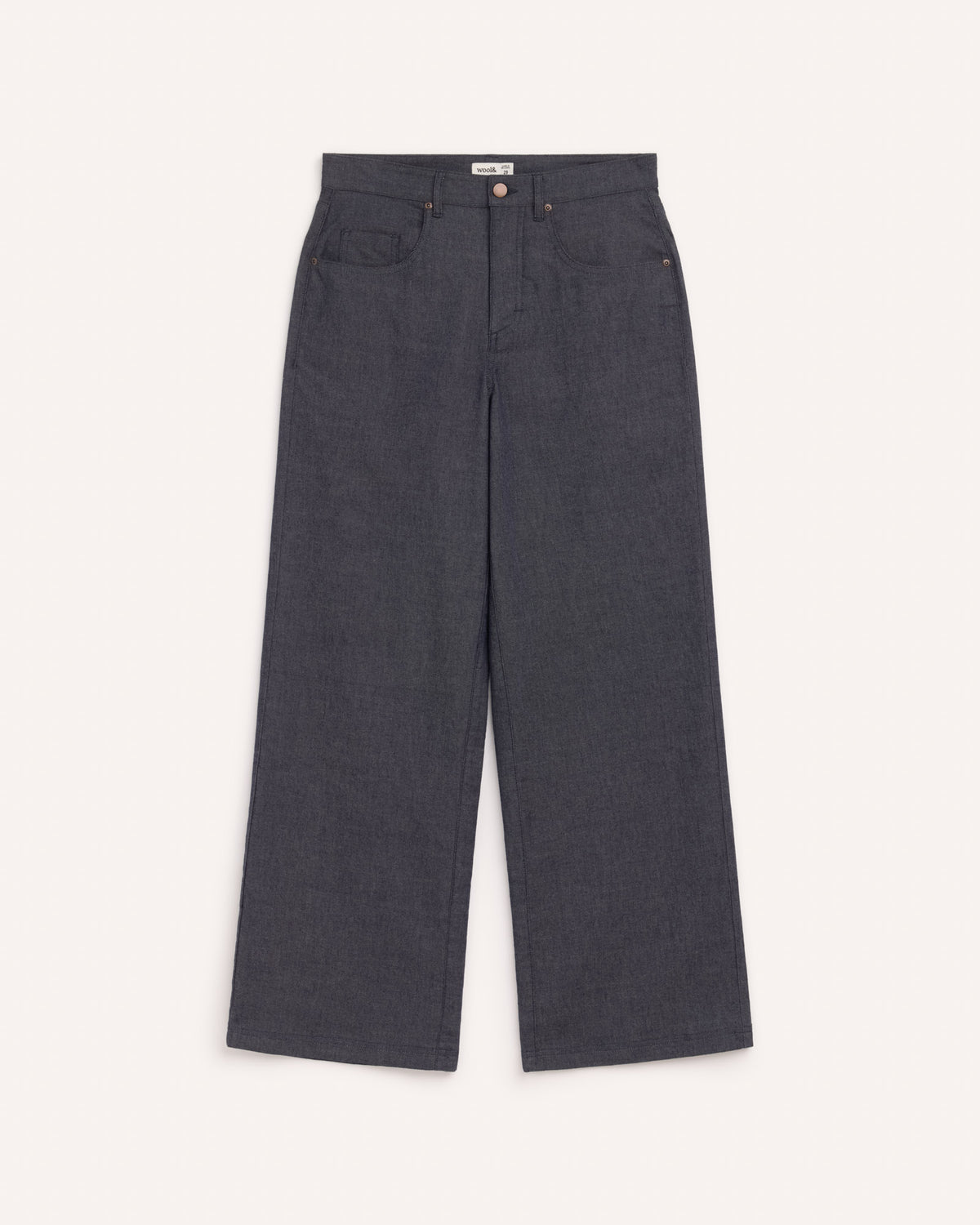 Model wearing Beck Wide Leg Denim Jean in . Beck Wide Leg Denim Jean is a merino wool pant with pockets available in sizes 26-43.