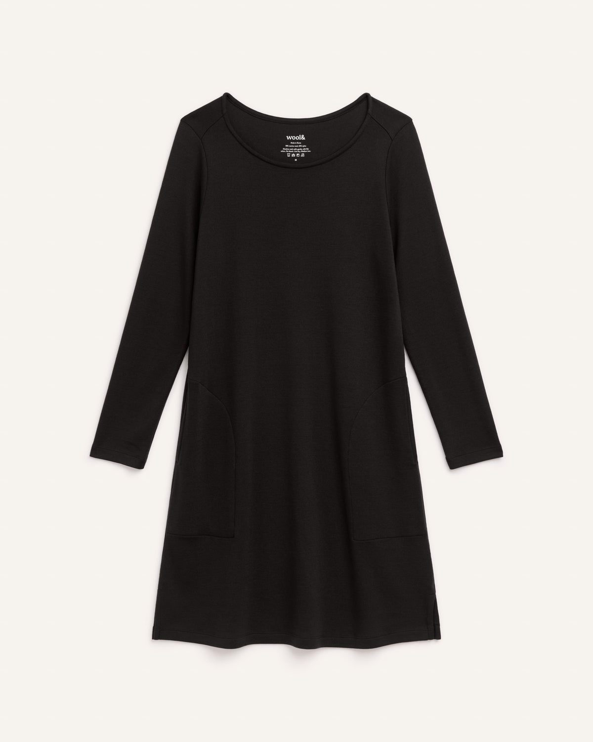 Laydown of Margo Shift Dress in Black. Margo Shift Dress is a merino wool long sleeve, boatneck, knee length shift dress with pockets available in sizes XS-3X Regular, S-3X Long.