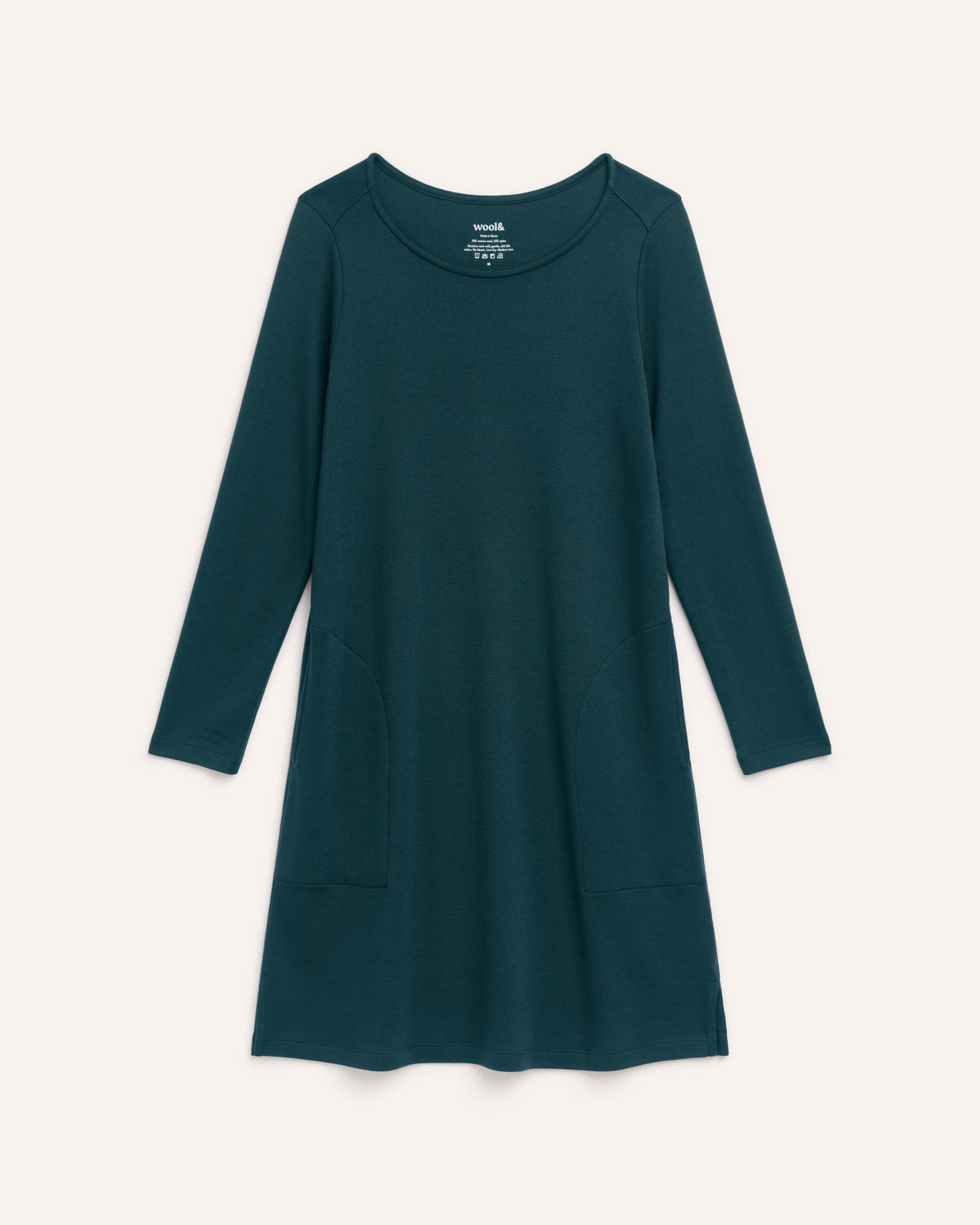 Laydown of Margo Shift Dress in Pine, a saturated forest green color. Margo Shift Dress is a merino wool long sleeve, boatneck, knee length shift dress with pockets available in sizes XS-3X Regular, S-3X Long.