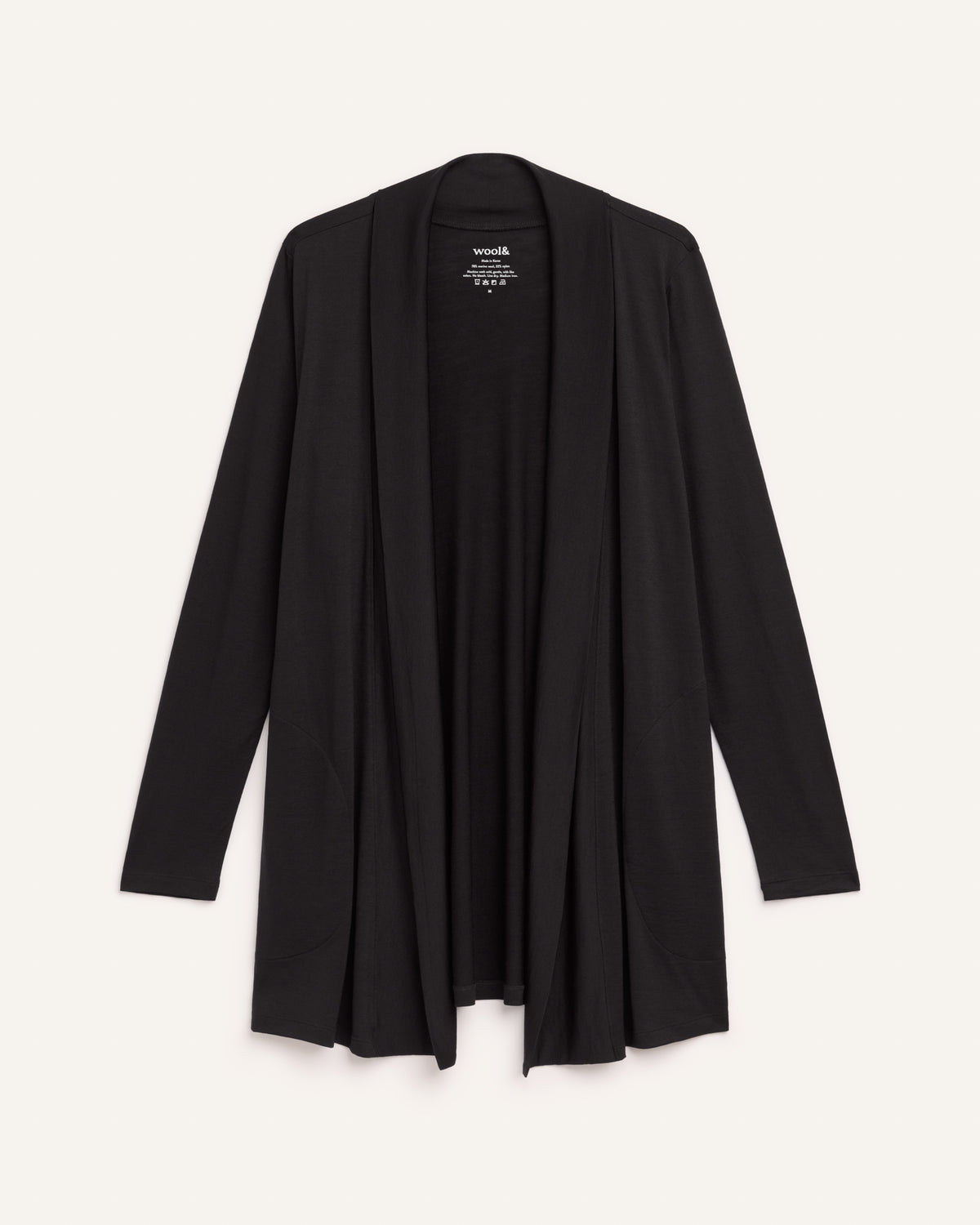 Laydown of Landmark Cardigan in Black. Landmark Cardigan is a merino wool long sleevecardigan with pockets available in sizes XS-3X.