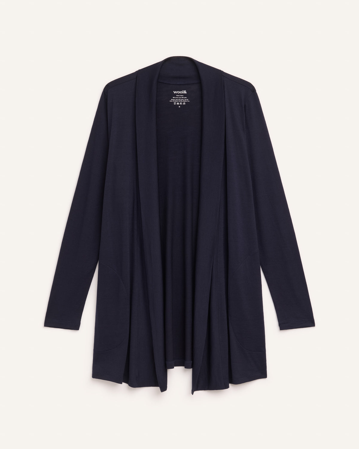 Laydown of Landmark Cardigan in Washed Navy. Landmark Cardigan is a merino wool long sleevecardigan with pockets available in sizes XS-3X.