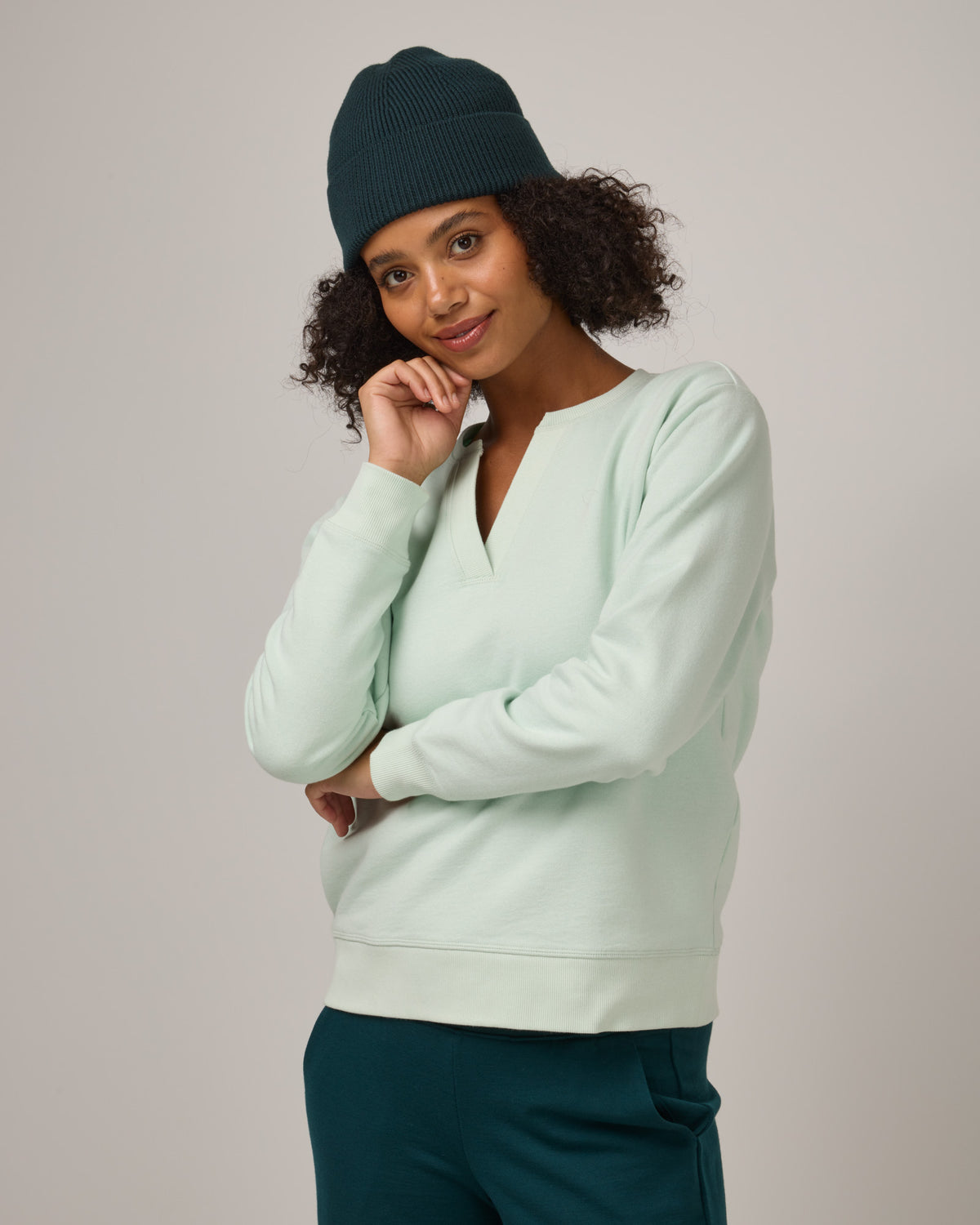 Model wearing Rory Ribbed Beanie in . Rory Ribbed Beanie is a merino wool hat available in one size.