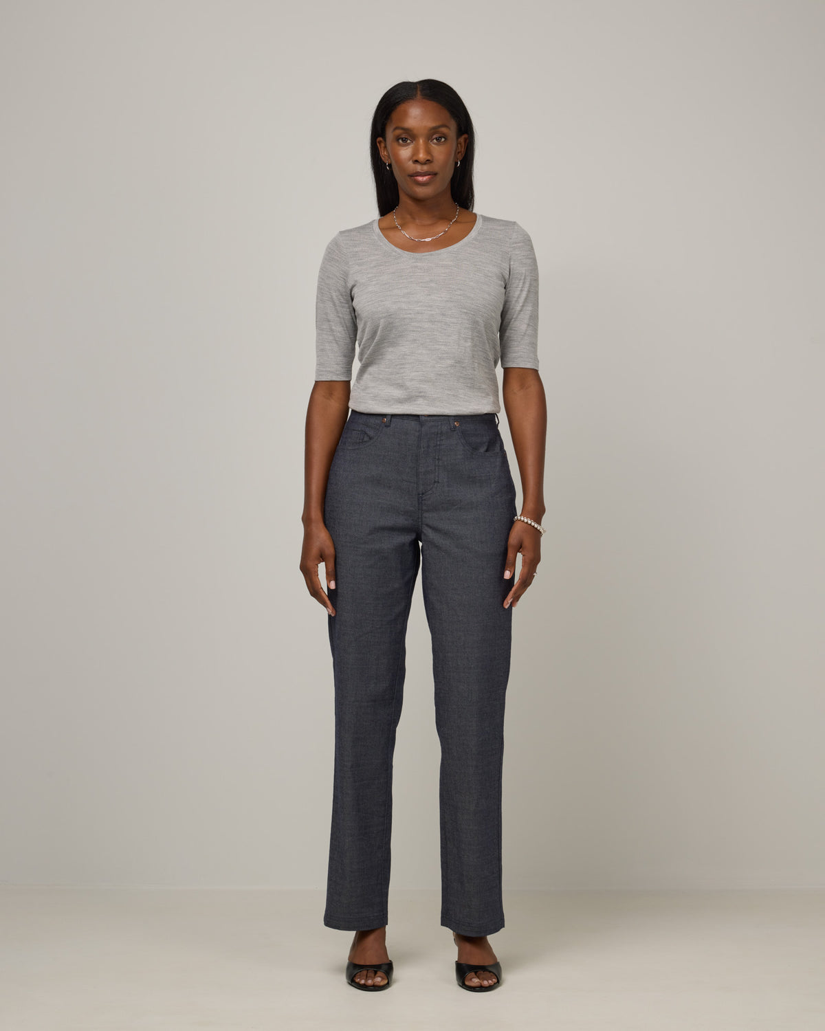 Model wearing Hawthorne Straight Leg Denim Jean in Indigo Blue. Hawthorne Straight Leg Denim Jean is a merino wool pant with pockets available in sizes 26-34.