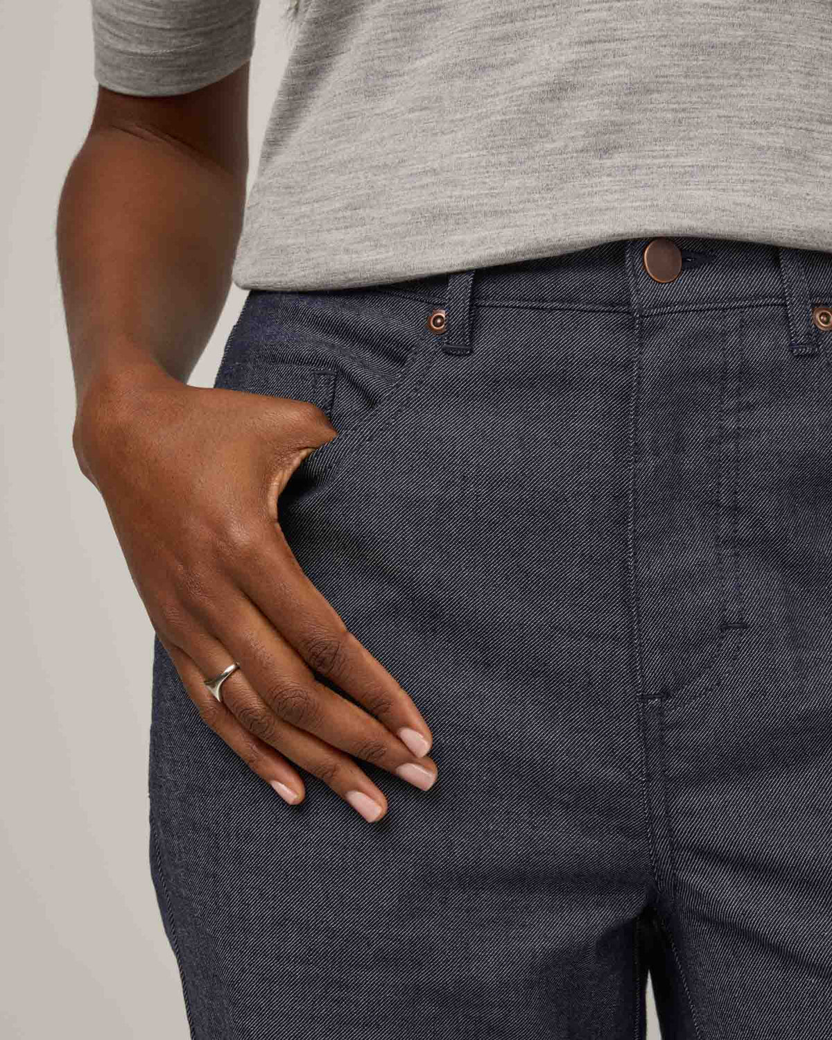 Model wearing Hawthorne Straight Leg Denim Jean in Indigo Blue. Hawthorne Straight Leg Denim Jean is a merino wool pant with pockets available in sizes 26-34.