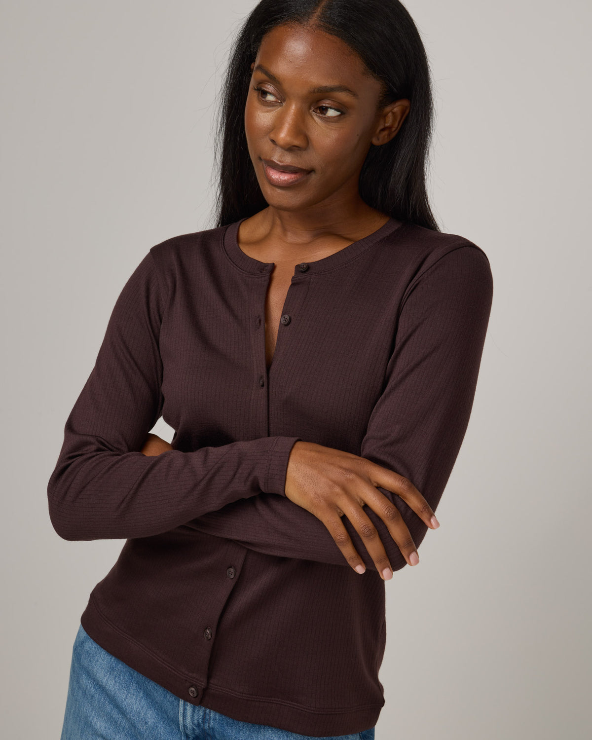 Model wearing Celeste Ribbed Cardigan in Espresso, a dark brown color. Celeste Ribbed Cardigan is a merino wool long sleeve, cardigan available in sizes XS-3X.