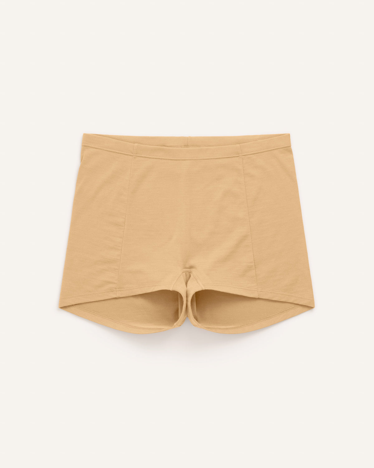 Laydown of Roam High Waist Shortie in Fawn, a light nude color. Roam High Waist Shortie is a merino wool underwear available in sizes XS-3X.