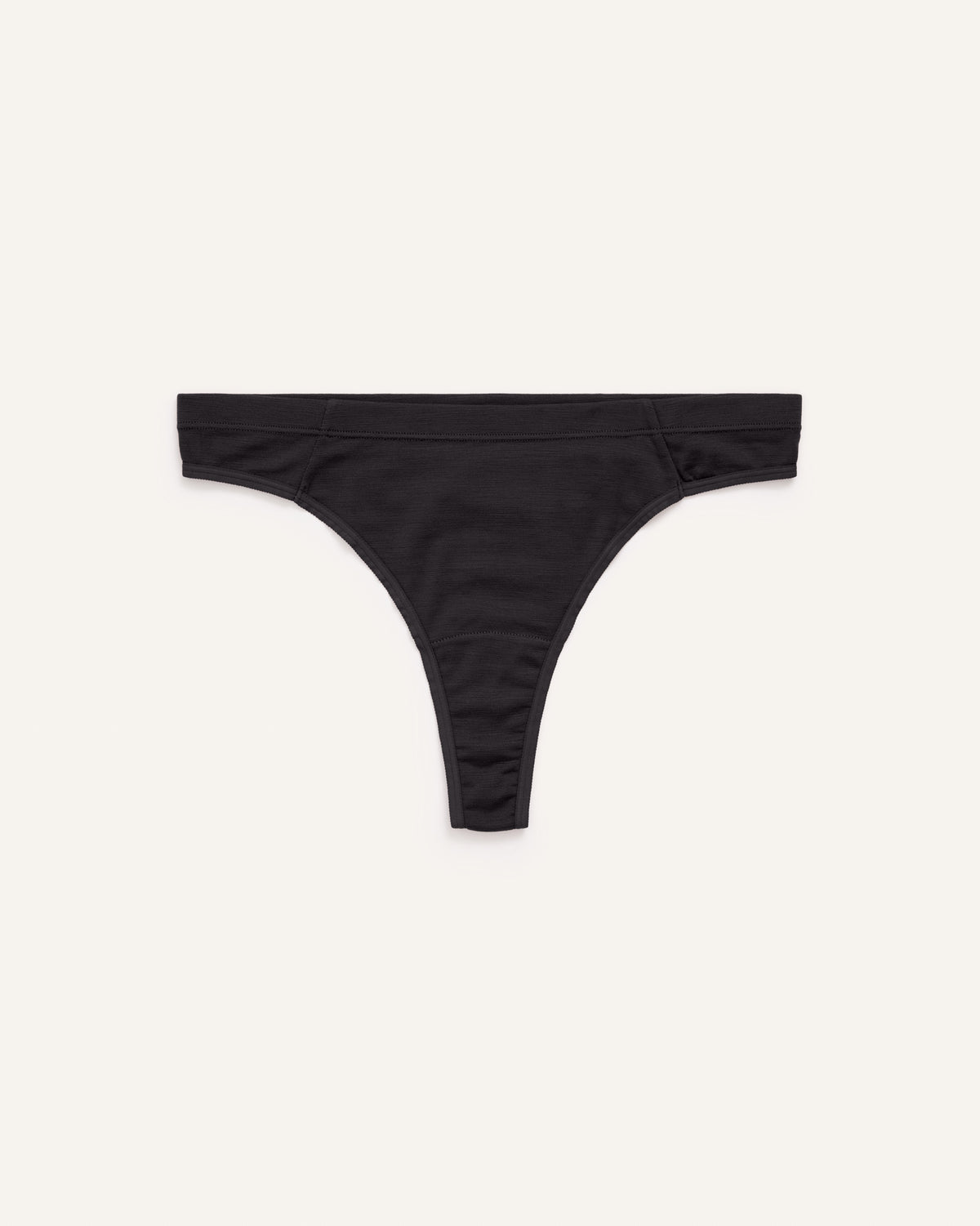 Laydown of Roam Thong in Black. Roam Thong is a merino wool underwear available in sizes XS-3X.
