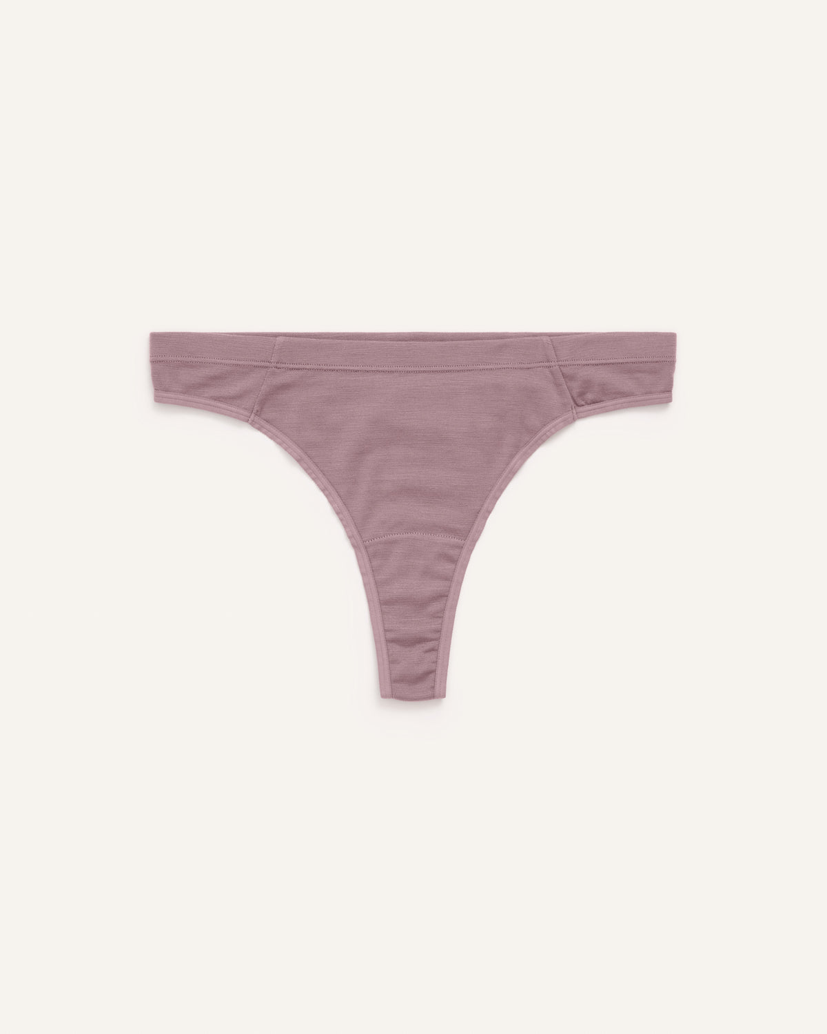 Laydown of Roam Thong in Lavender, a dusky muted purple color. Roam Thong is a merino wool underwear available in sizes XS-3X.