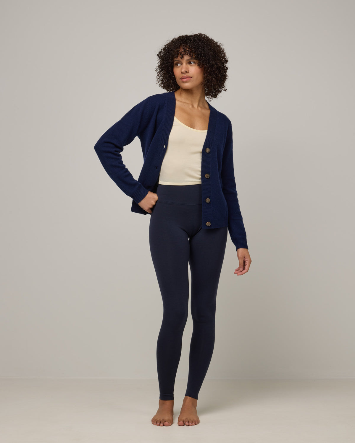 Model wearing Summit Legging in Navy. Summit Legging is a merino wool legging available in sizes XS-3X Regular, S-XXL Long.
