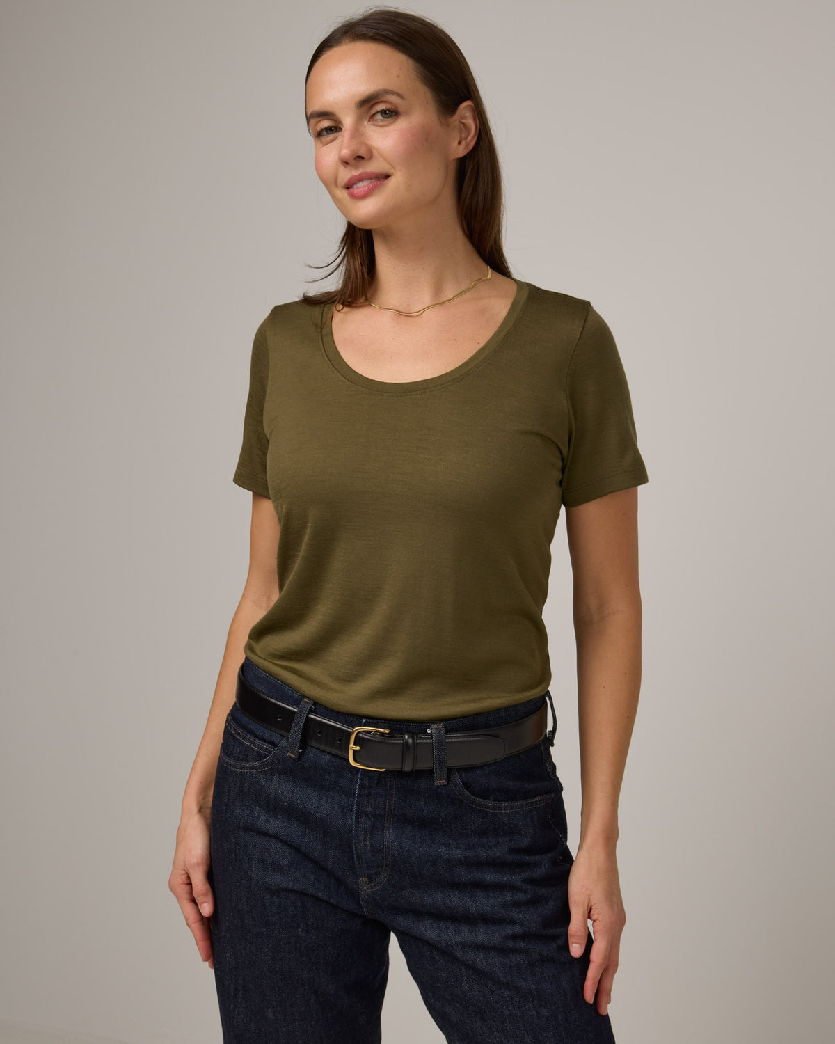 Model wearing Stella Signature Scoop Neck Tee in Olive. Stella Signature Scoop Neck Tee is a merino wool short sleeve, scoop neck, relaxed fit tee available in sizes XS-3X.